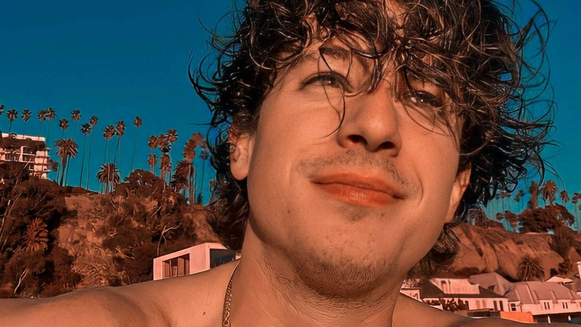 Charlie Puth On The Beach Background