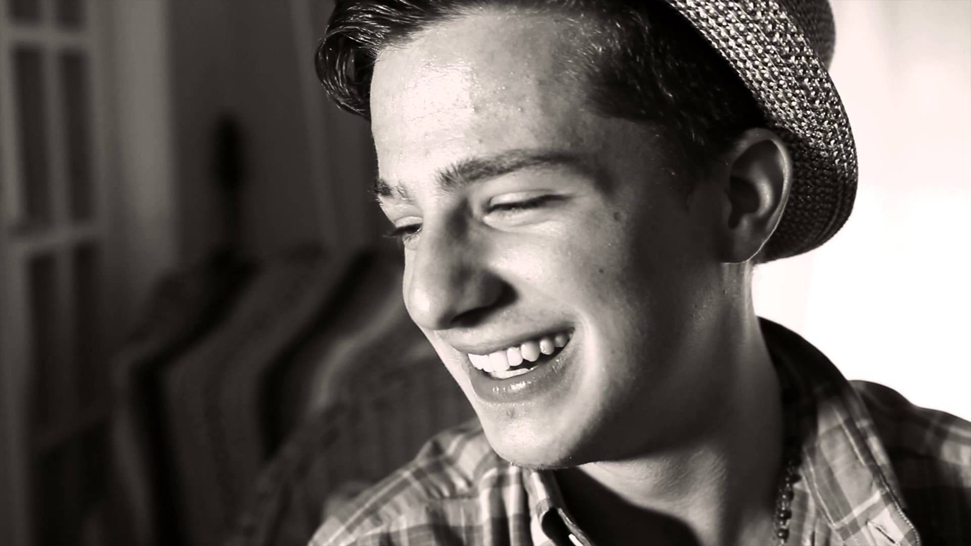 Charlie Puth Widely Smiling Background