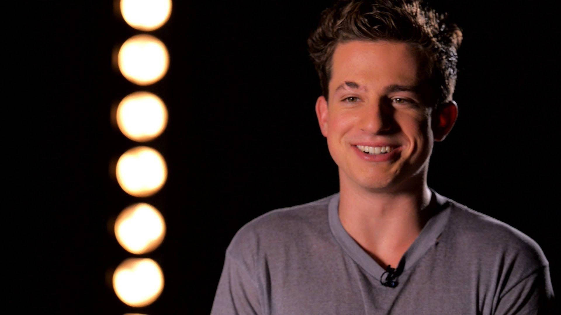 Charlie Puth With Bulbs Background