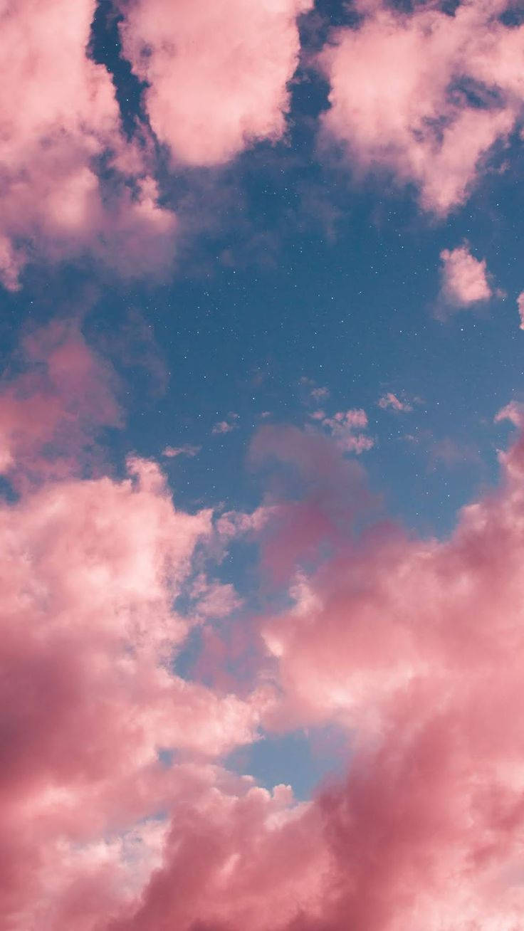 Charming Pink Cloud In A Serene Sky Wallpaper