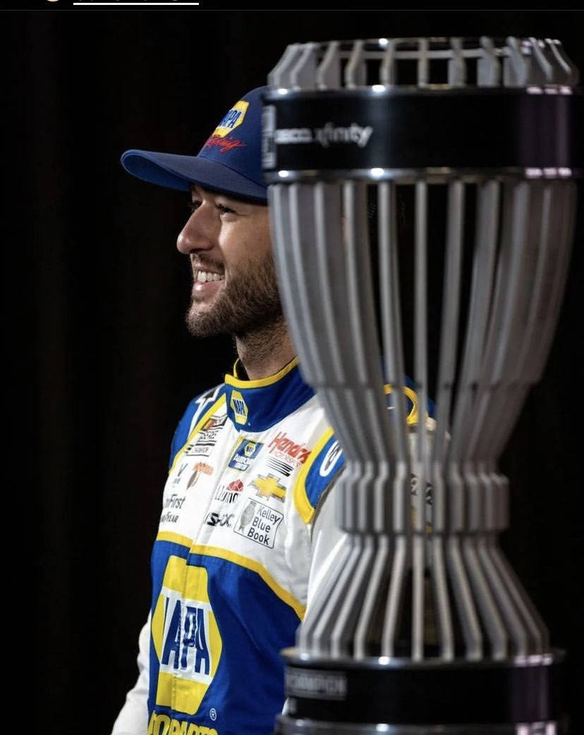 Chase Elliot Side Profile With Trophy Wallpaper