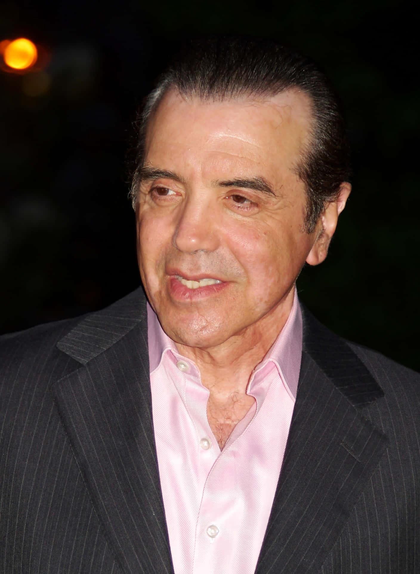 Acclaimed Actor Chazz Palminteri in Classic Black Suit Wallpaper