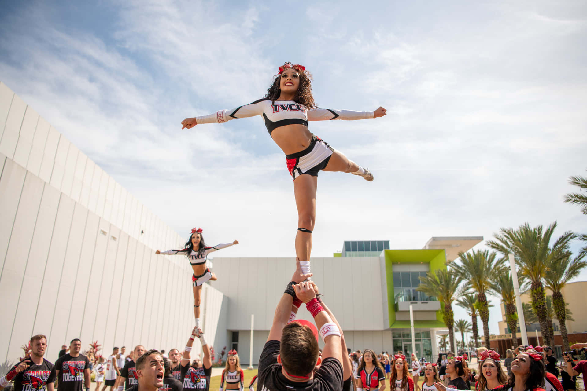 Cheerleader Perform Between Crowd Picture