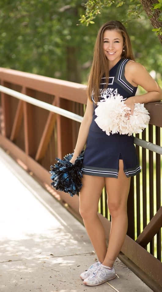 Niedlichesbild Von Cheerleadern In Einem Blauen, Passenden Outfit.