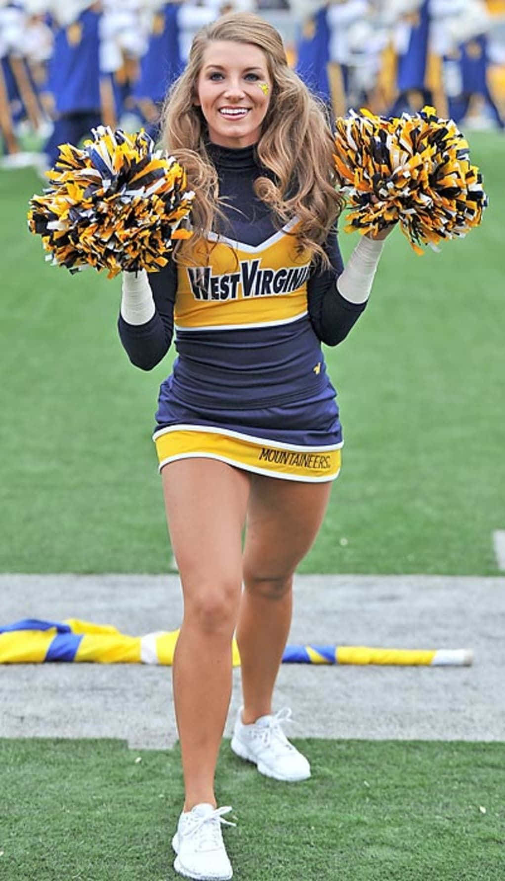 Download Cute Yellow Blue Cheerleaders Picture | Wallpapers.com