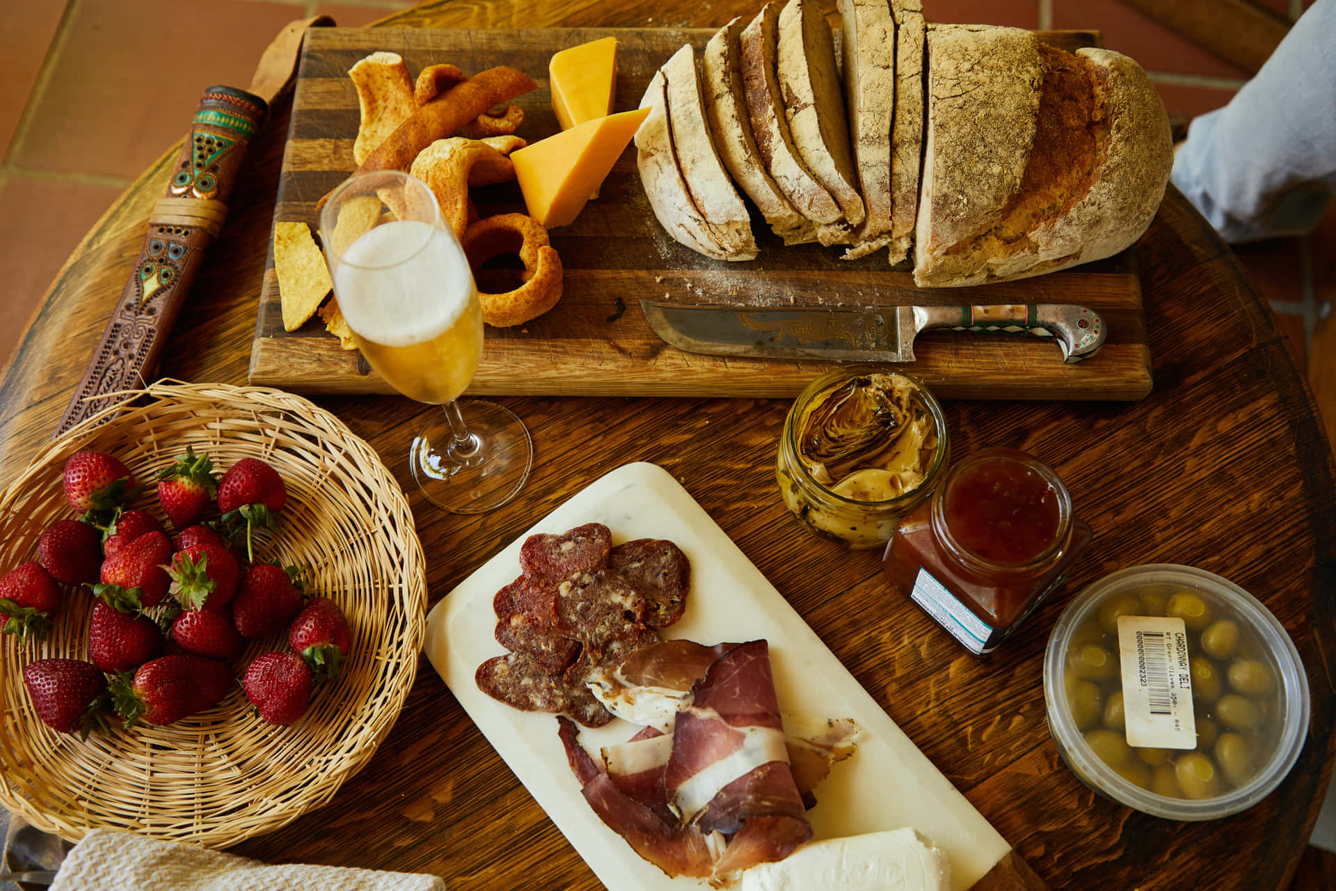 Cheese platter with various types of cheese and fresh grapes