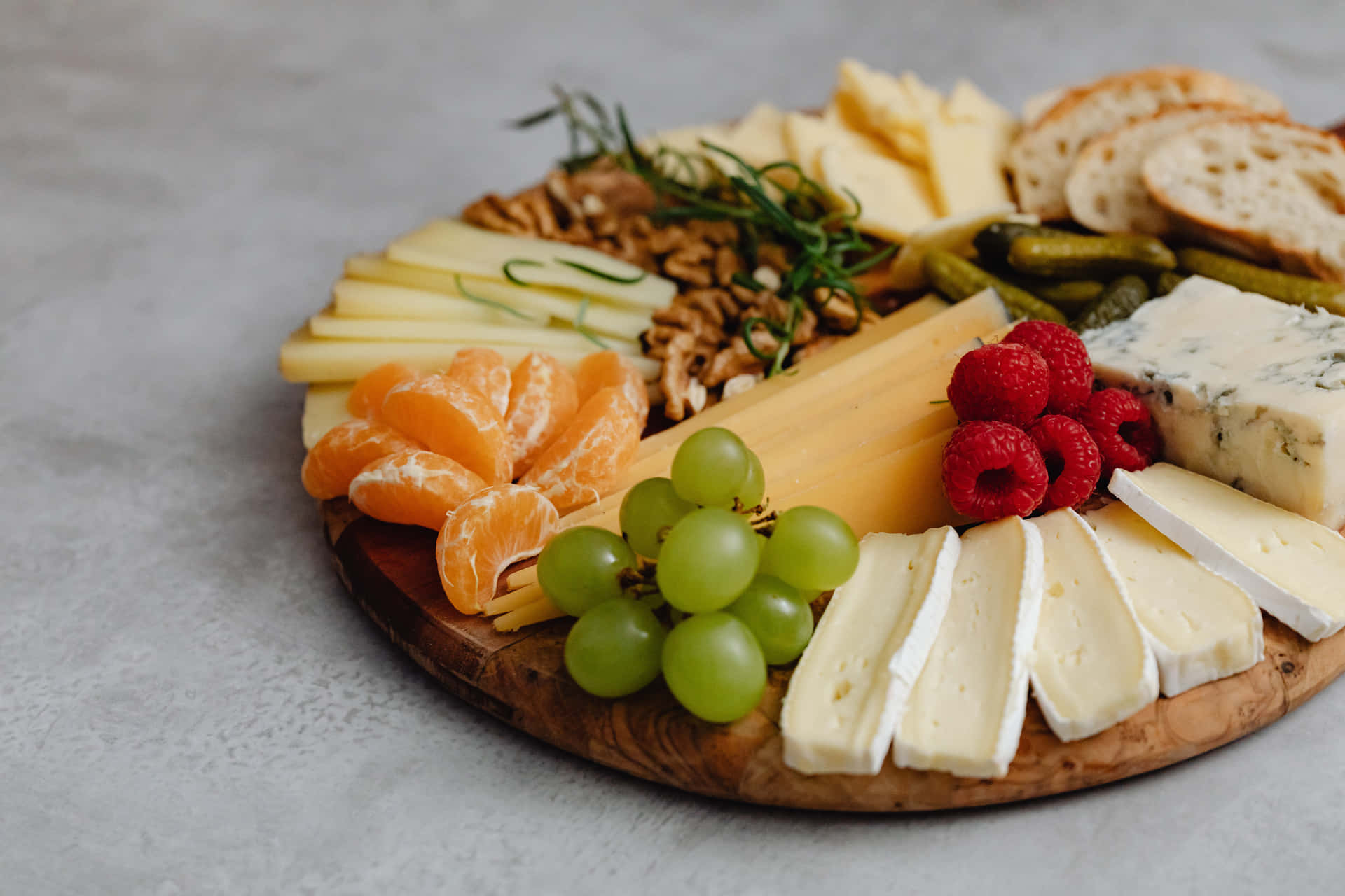 A Delicious Array of Cheeses on a Wooden Board