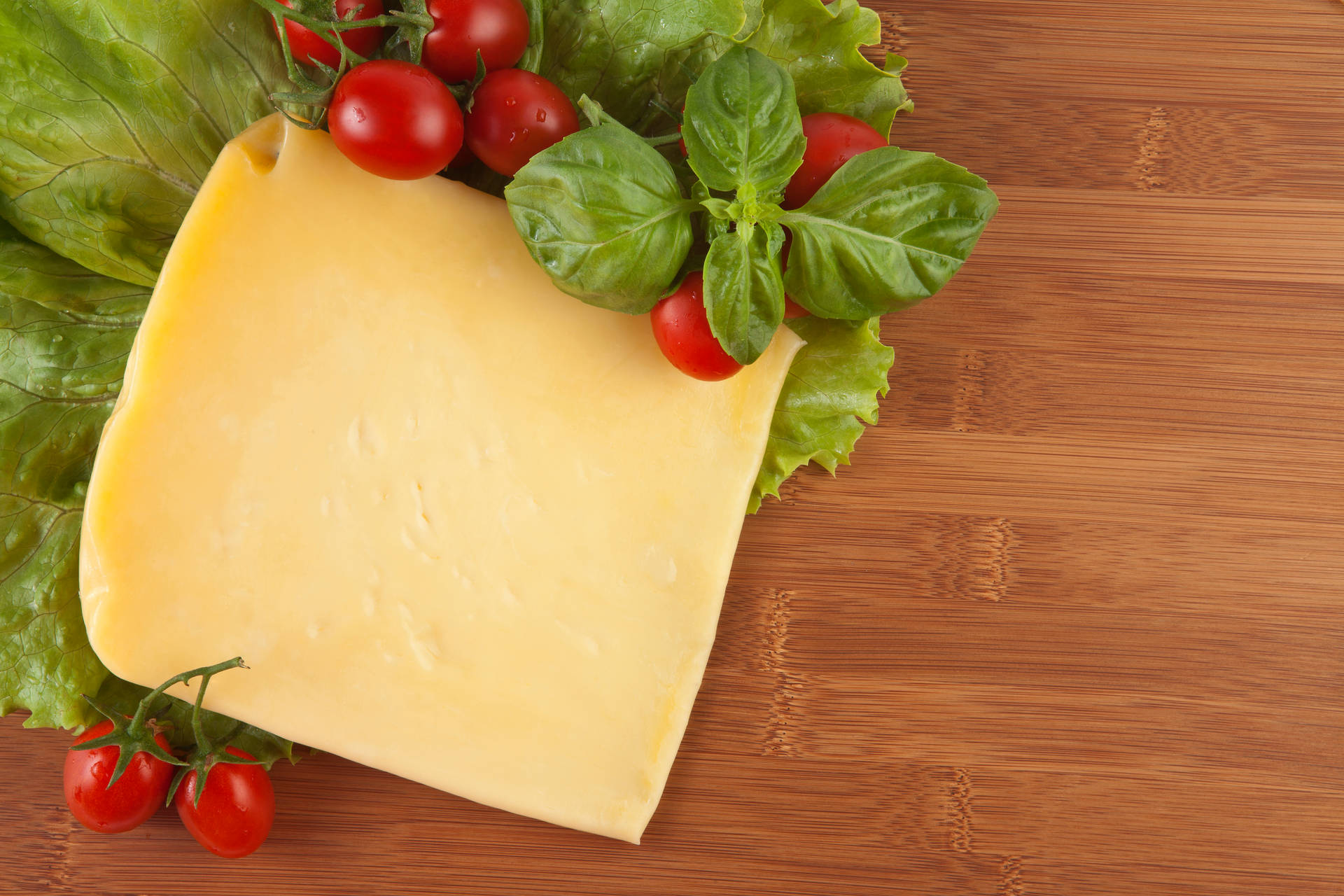 Cheese Slice With Cherry Tomatoes Wallpaper