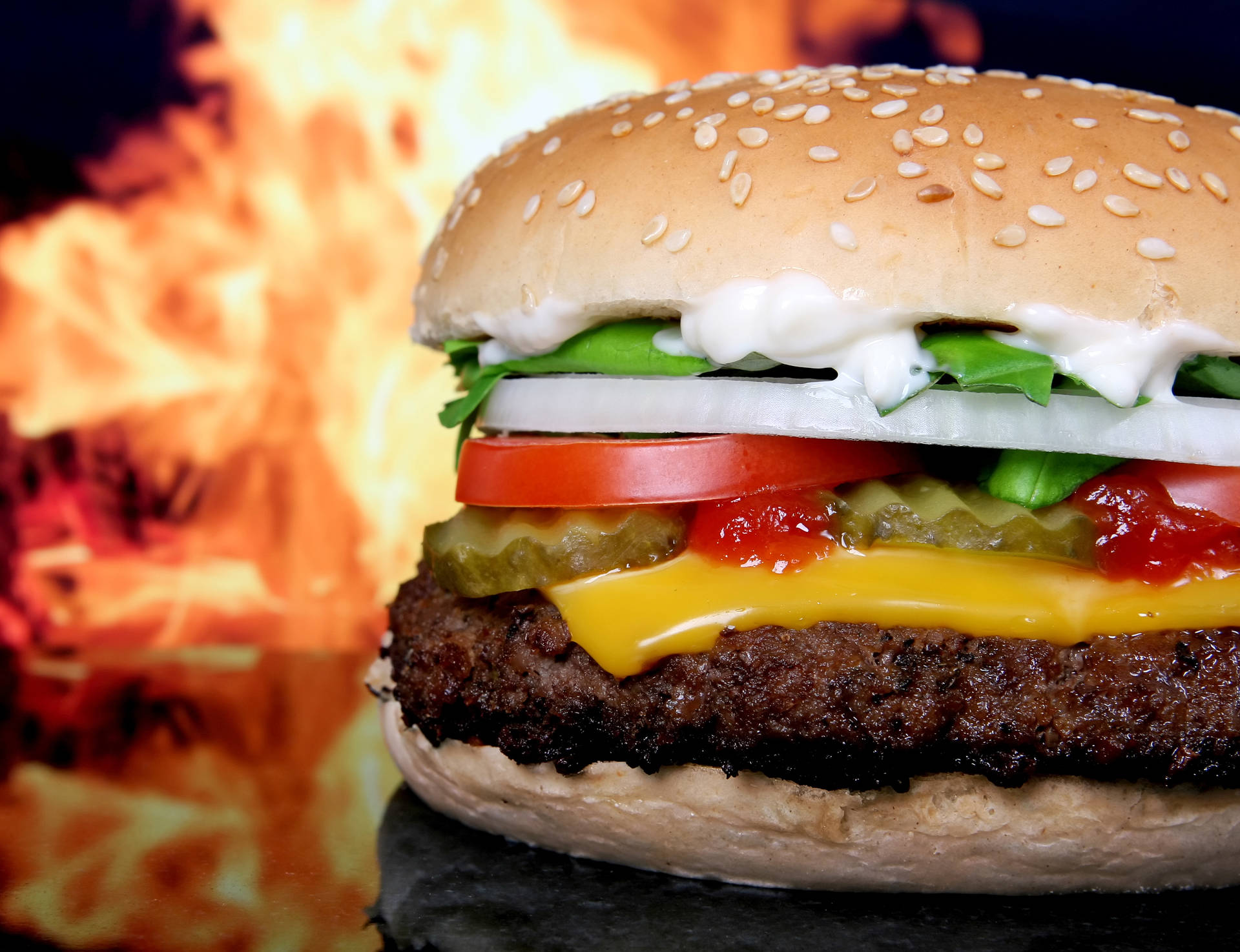 Cheeseburger On A Flame Background Wallpaper