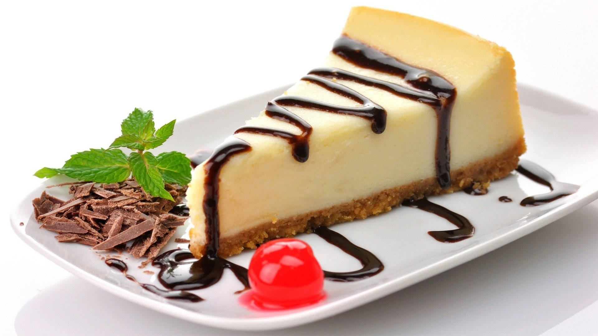 Cheesecake With Chocolate Syrup Dessert Wallpaper