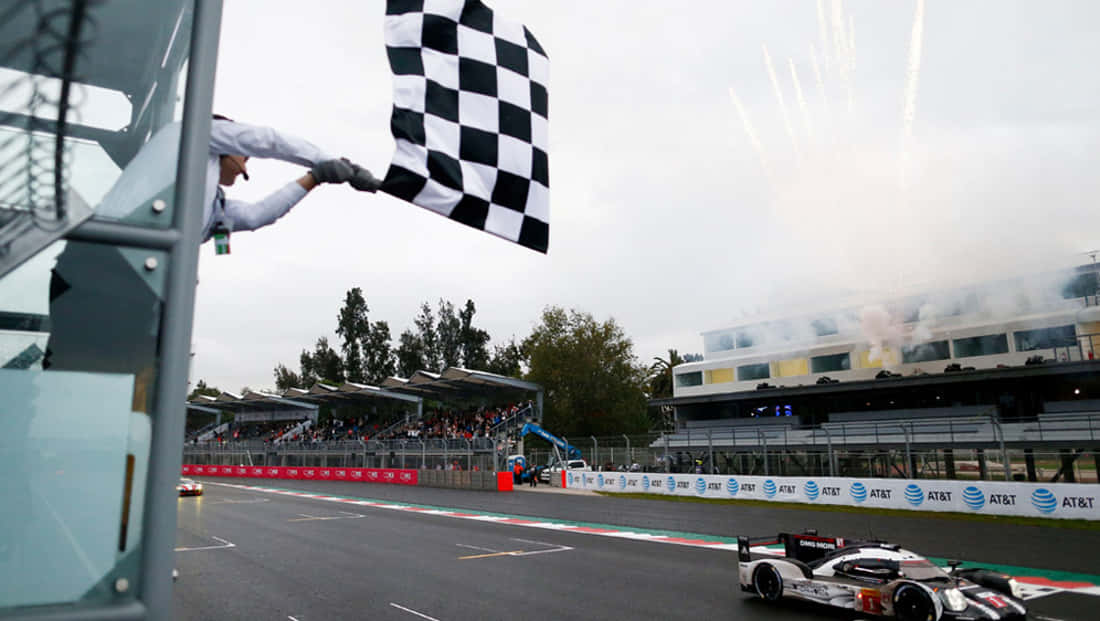 Chequered flag waving at the finish line Wallpaper