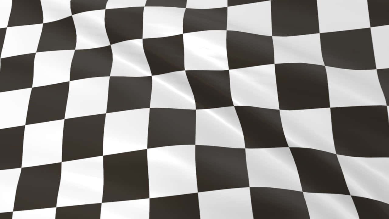Caption: Chequered Flag Waving on Race Track Wallpaper