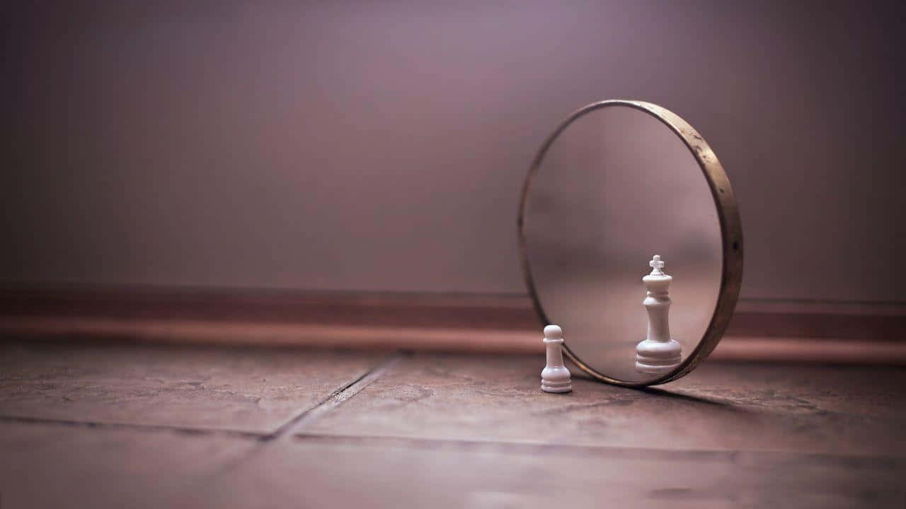 A Mirror With A Chess Piece In It