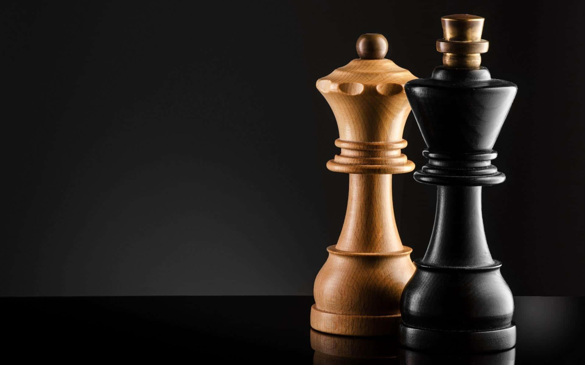 Two Chess Pieces On A Black Background