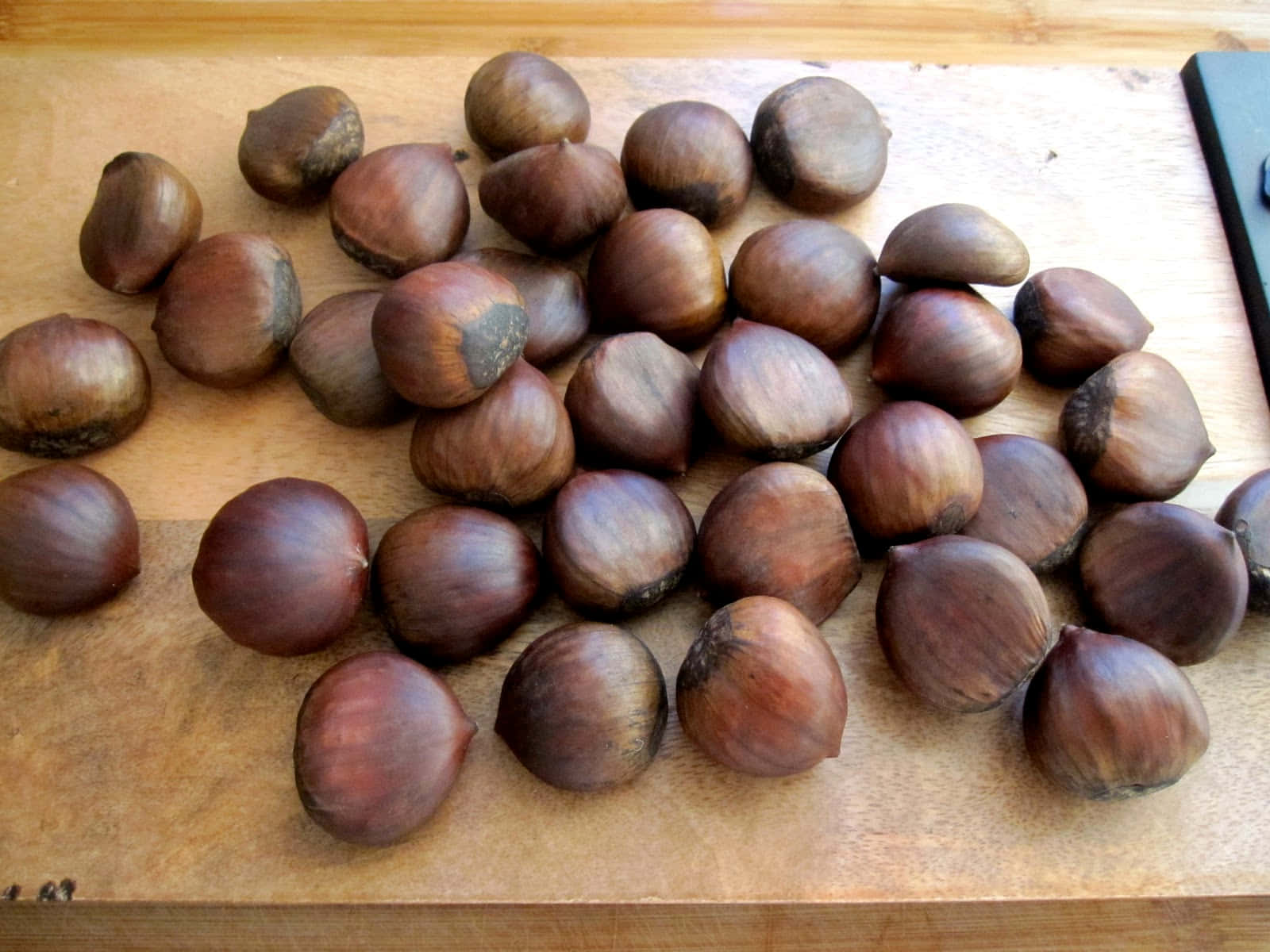 Beautiful Chestnut on a Wooden Surface Wallpaper