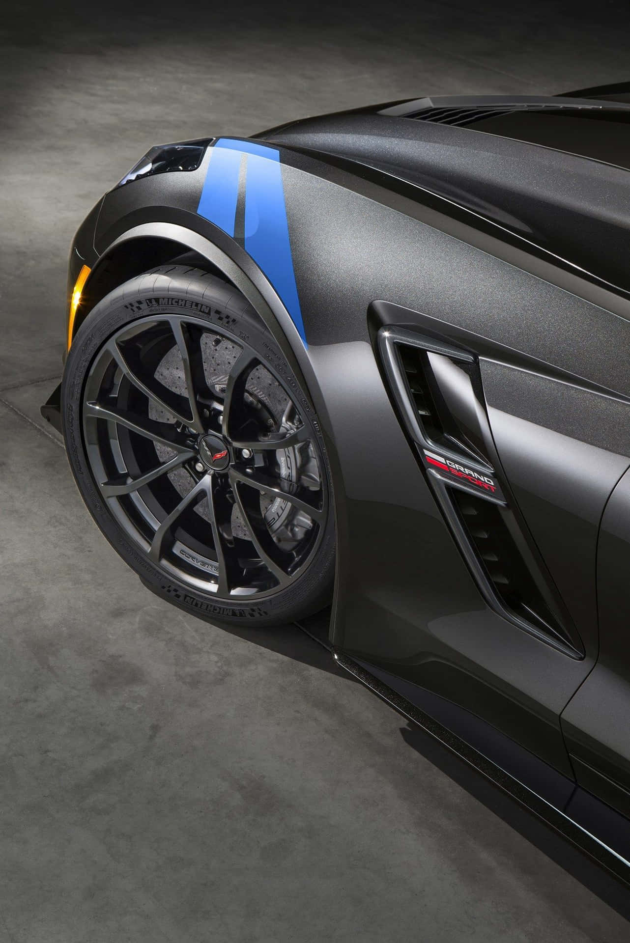 Stunning Chevrolet Corvette Grand Sport in motion on the track Wallpaper