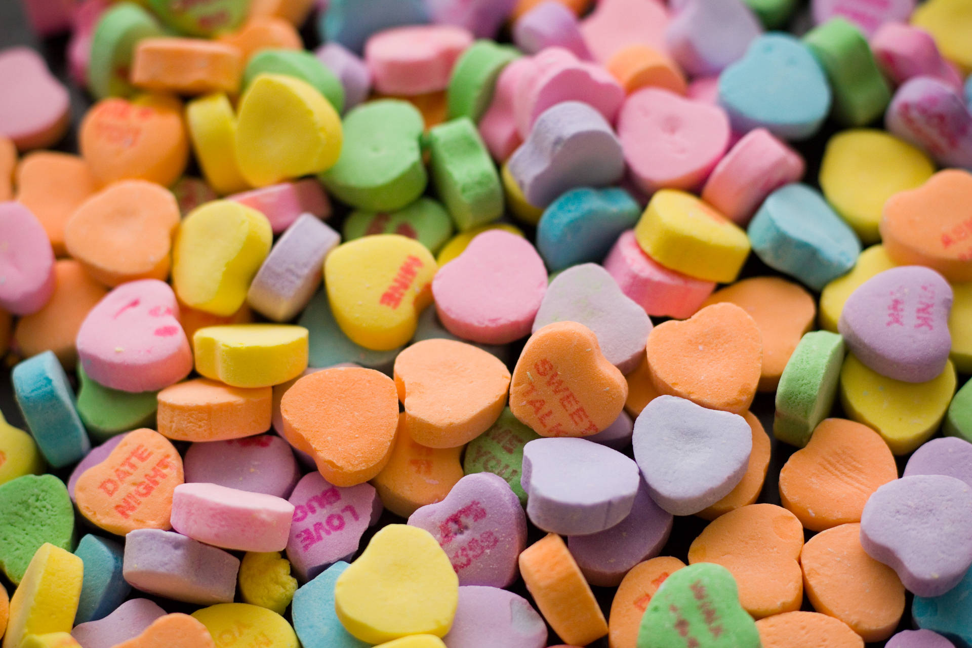 A colorful assortment of chewy candy hearts. Wallpaper