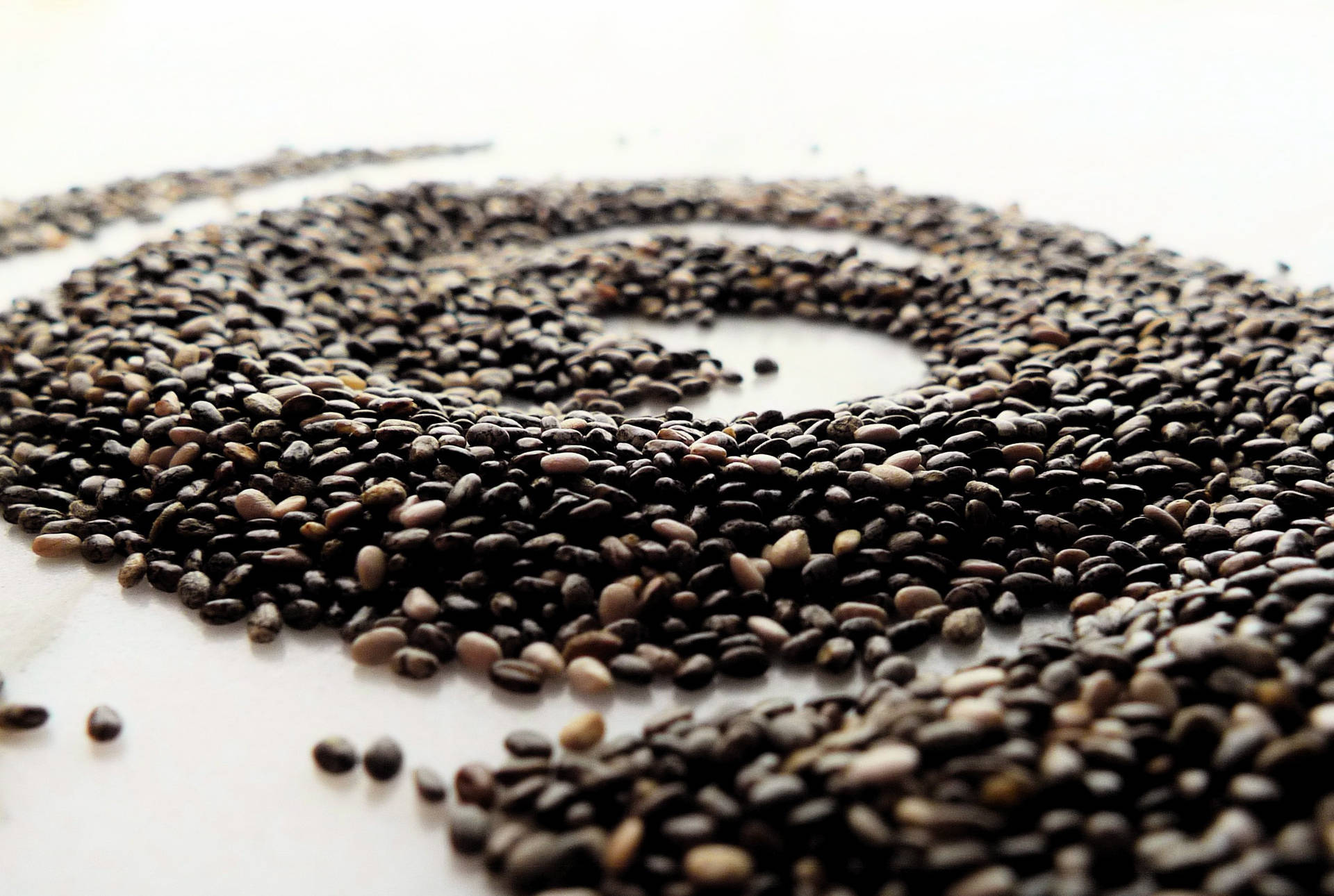 Nutritious Chia Seeds in Distinct Spiral Formation Wallpaper