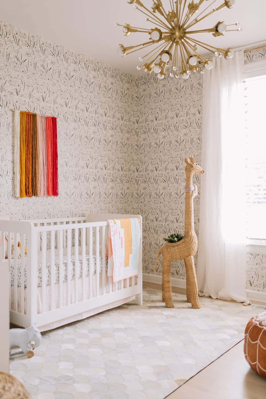Chic Nursery Room With Giraffe Accent Wallpaper