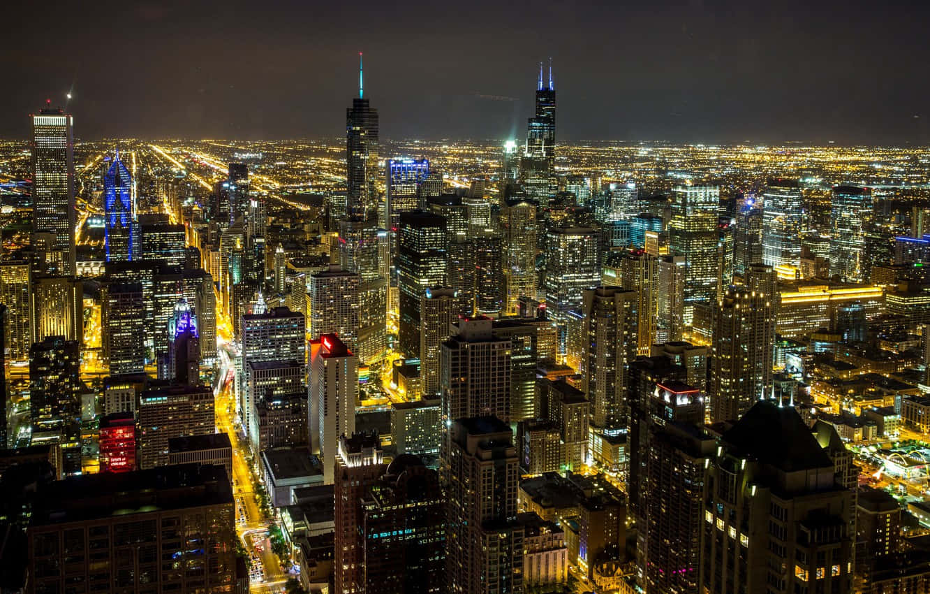 Dielichter Der Stadt Chicago Leuchten Hell In Der Nacht. Wallpaper