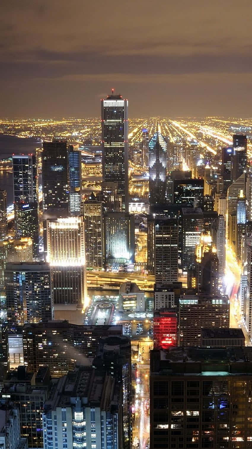 Admire the beauty of Chicago City at night Wallpaper