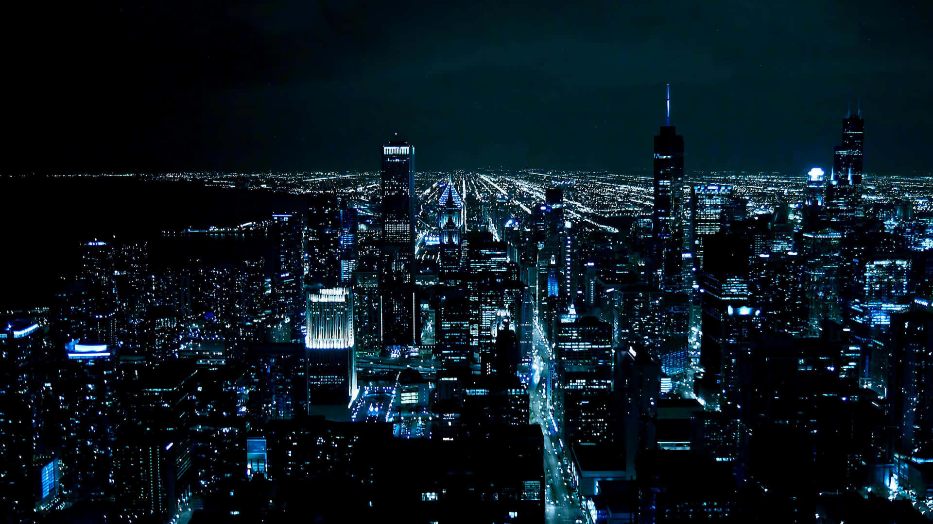 Chicagostad På Natten Med Blåa Ljus. Wallpaper