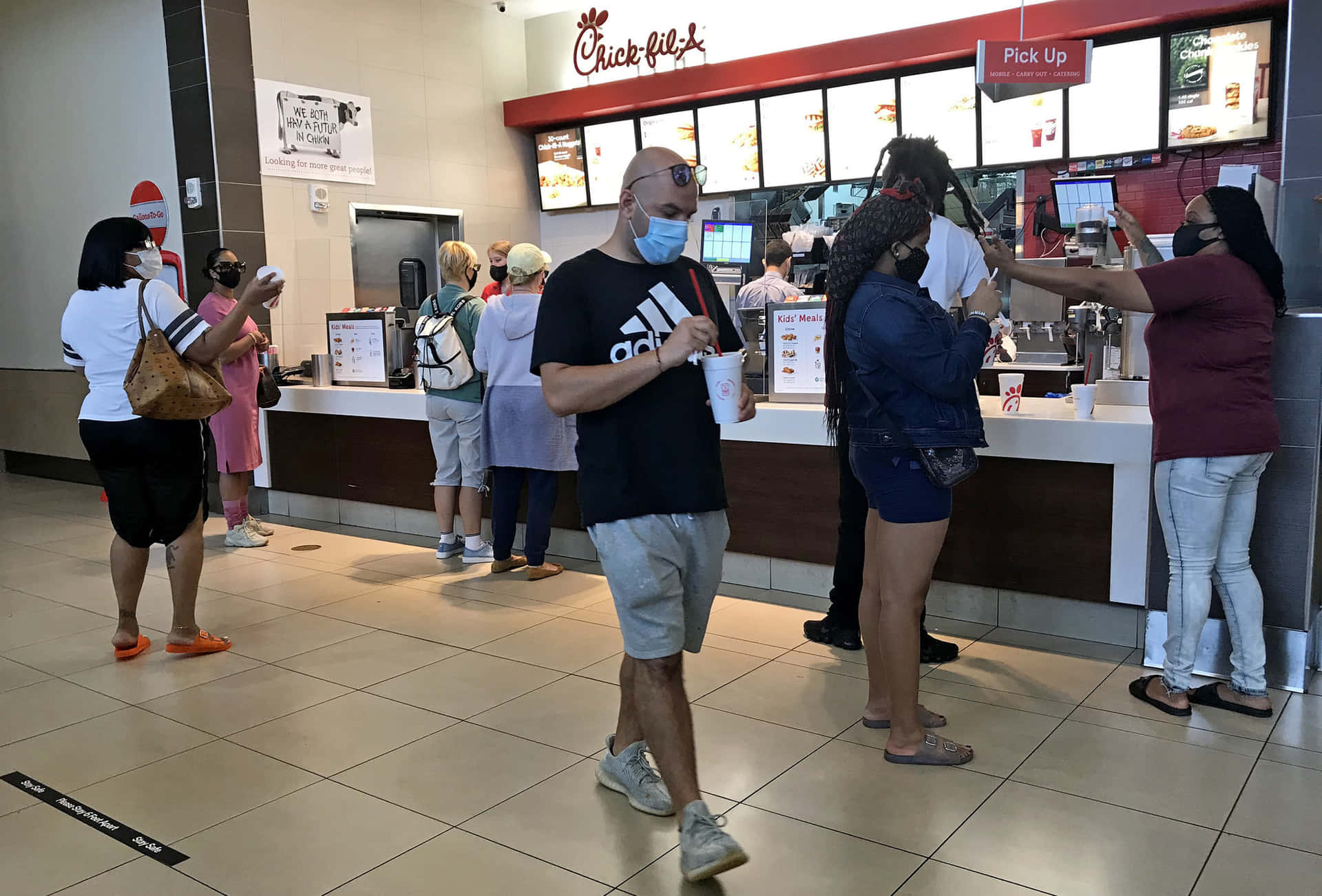 People Standing In Line At A Fast Food Restaurant
