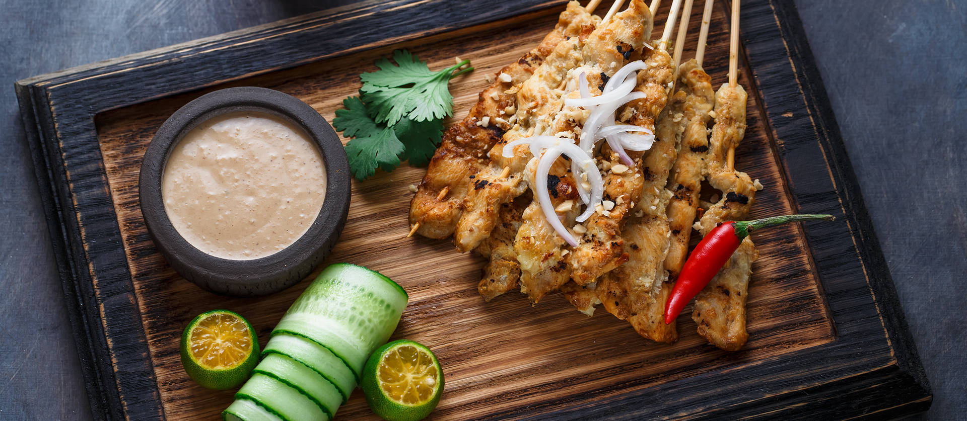 Chicken Satay On Black And Brown Wooden Tray Wallpaper