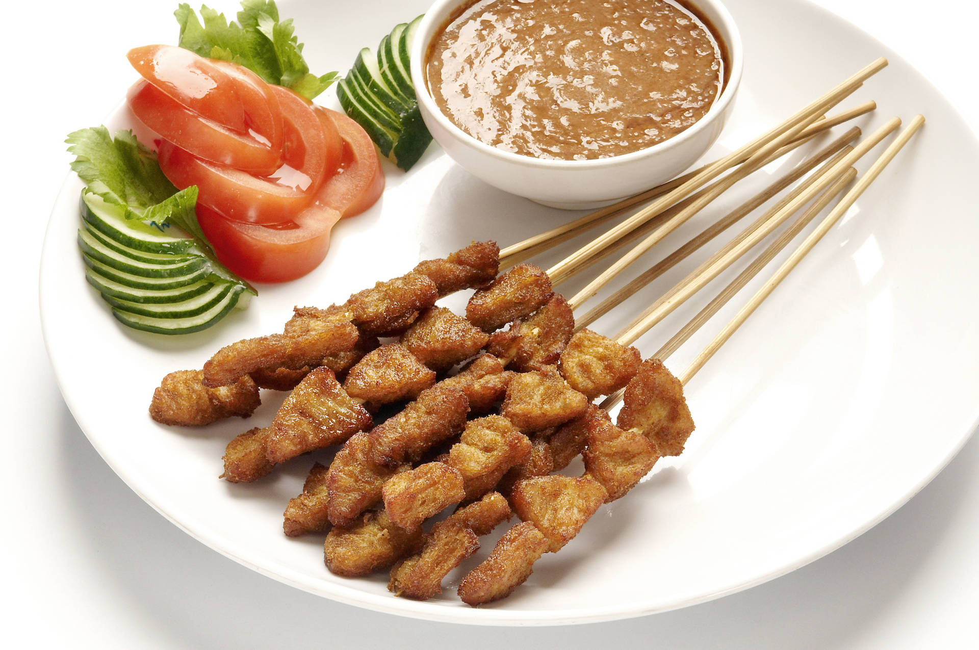 Savory Chicken Satay on a Tranquil White Plate Wallpaper