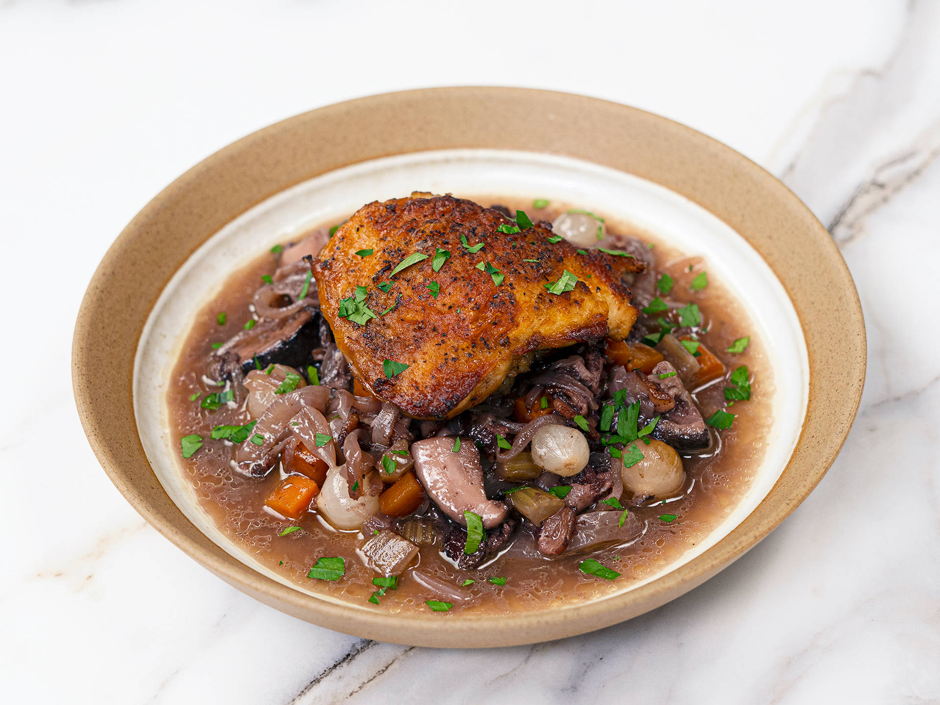 Classic French Coq au Vin in Hearty Sauce Wallpaper