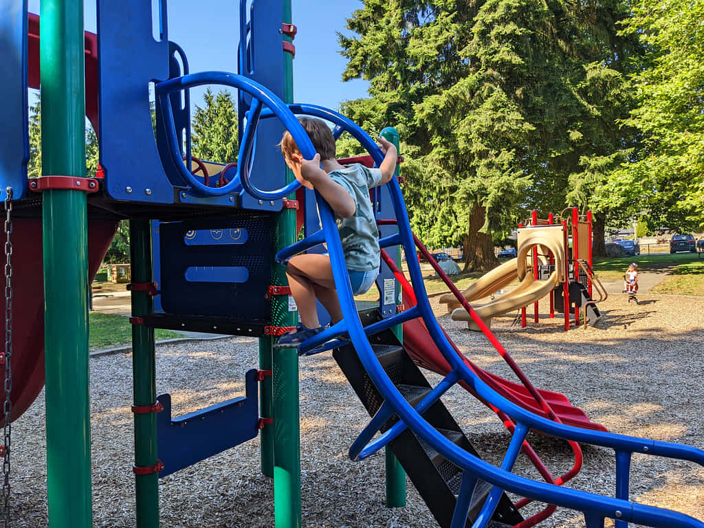 Child Climbing Playground Equipment Burnaby Wallpaper