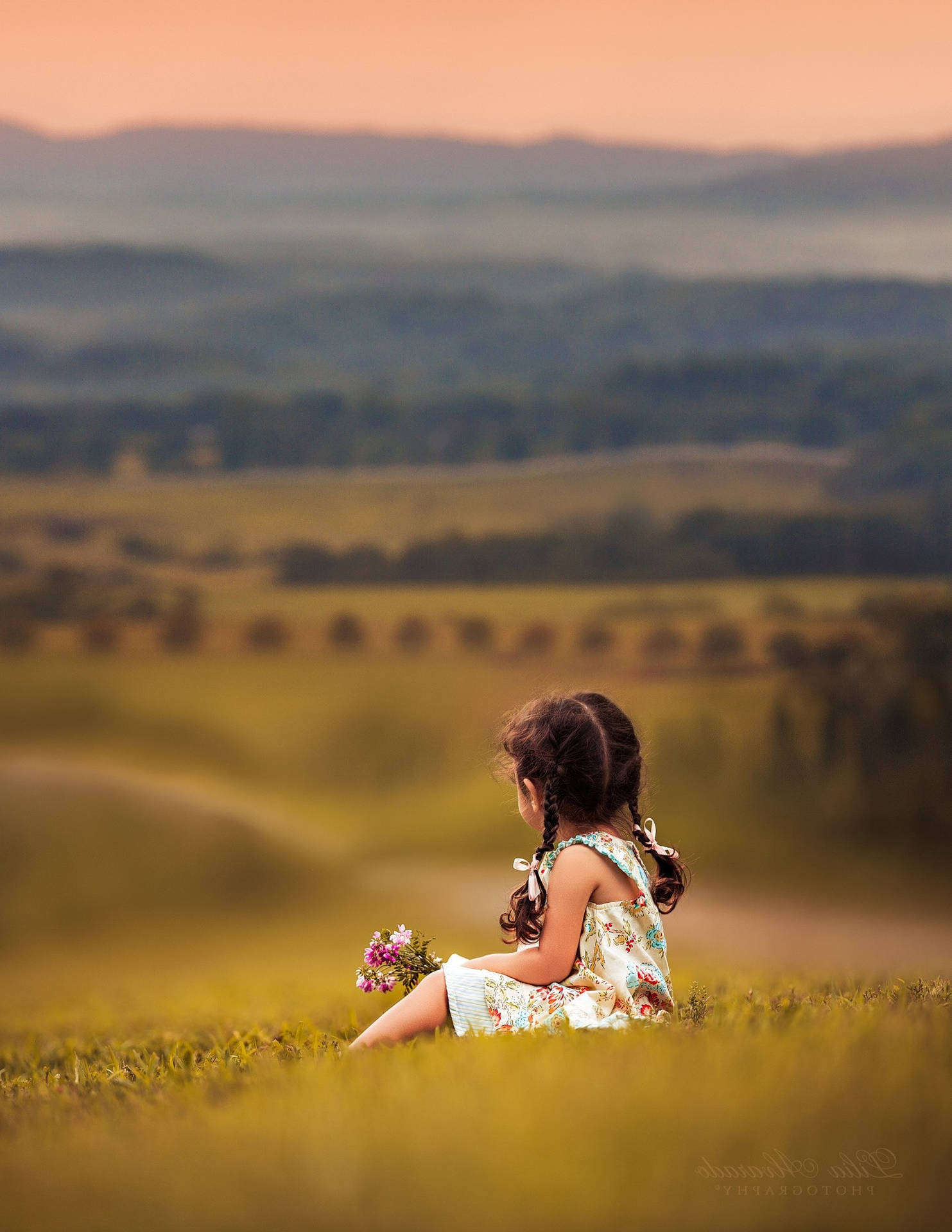 Child Holding Flowers In The Fields Wallpaper