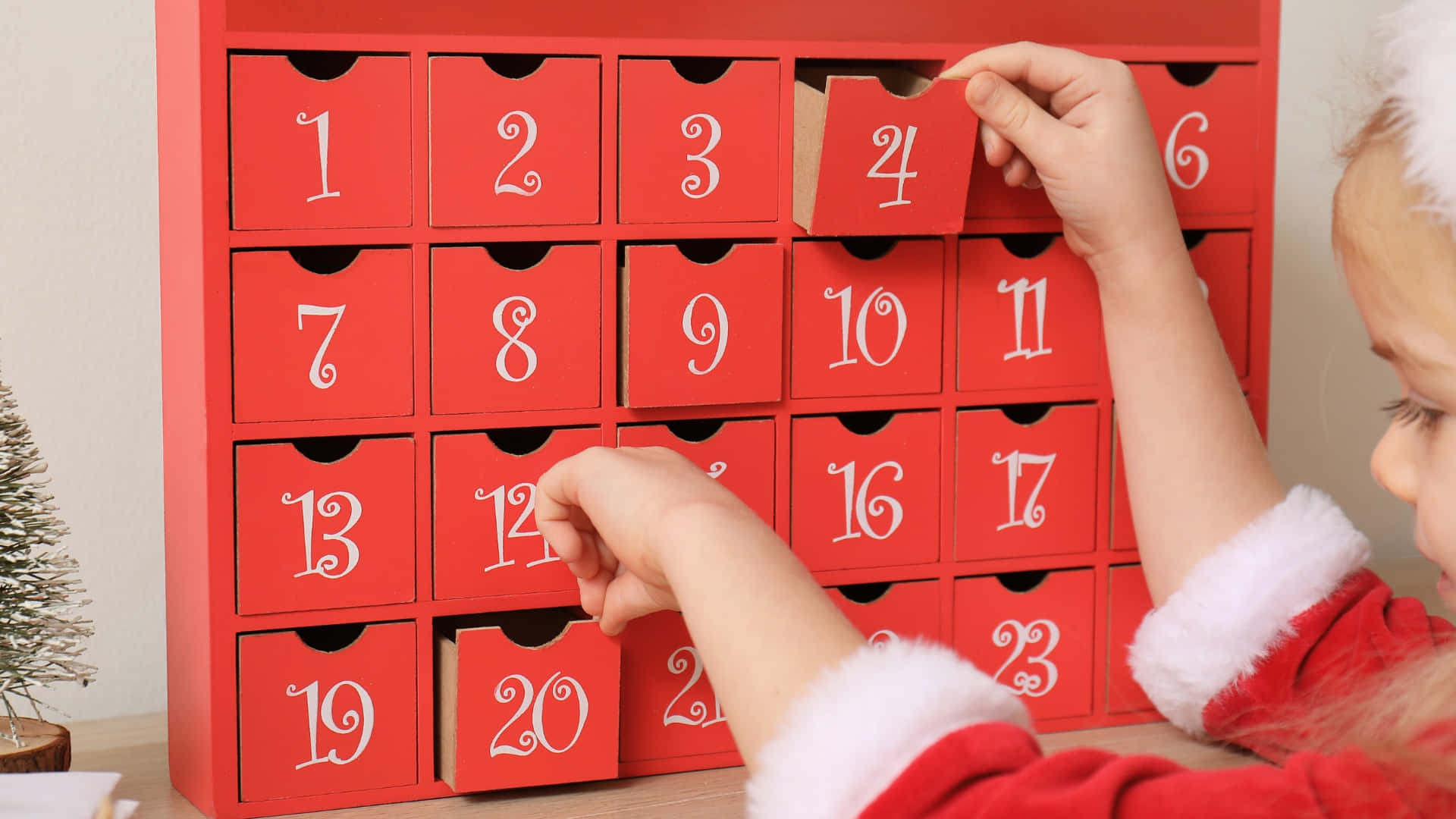 Child Opening Christmas Advent Calendar Wallpaper