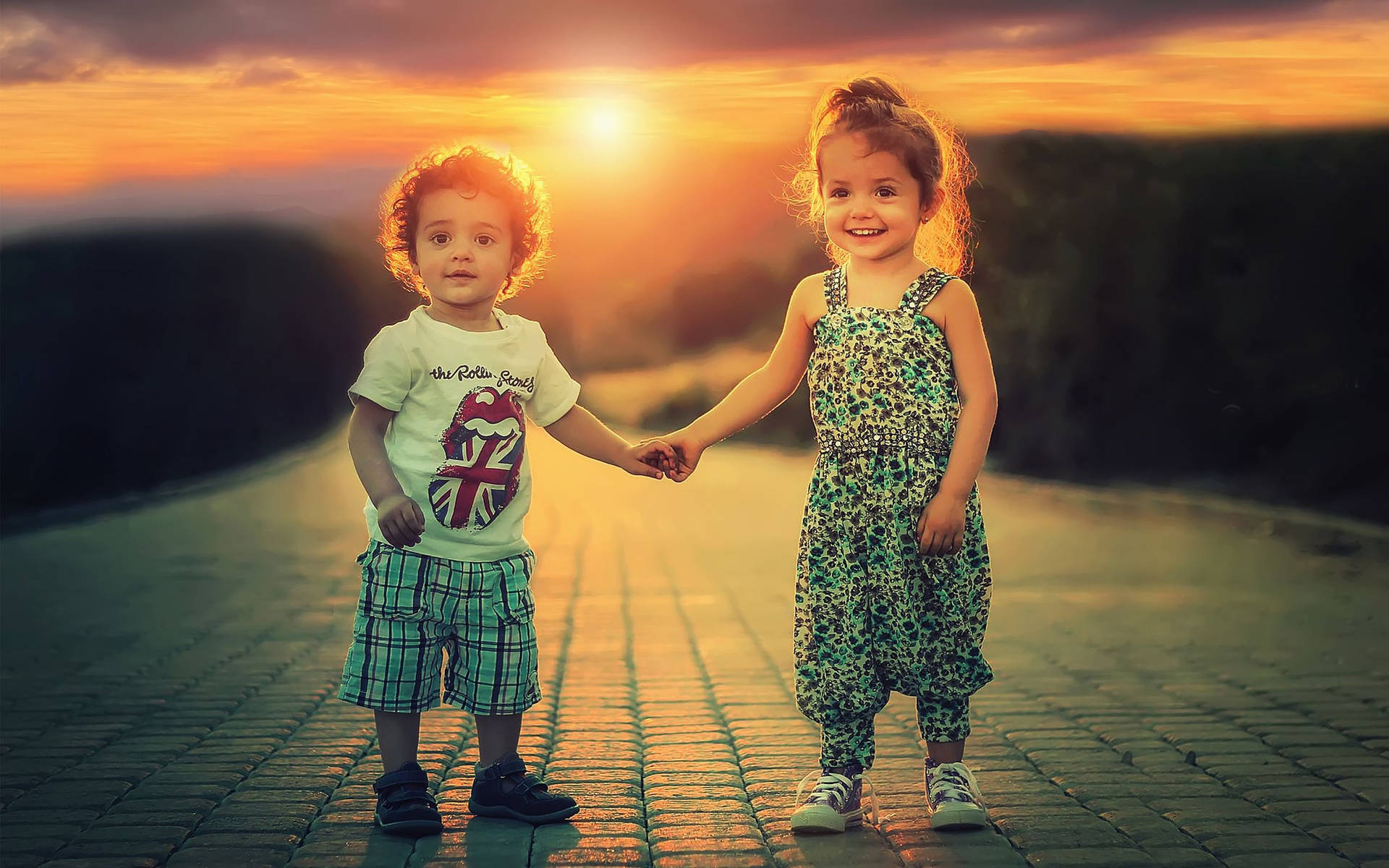 Children Holding Hands At Sunset Wallpaper