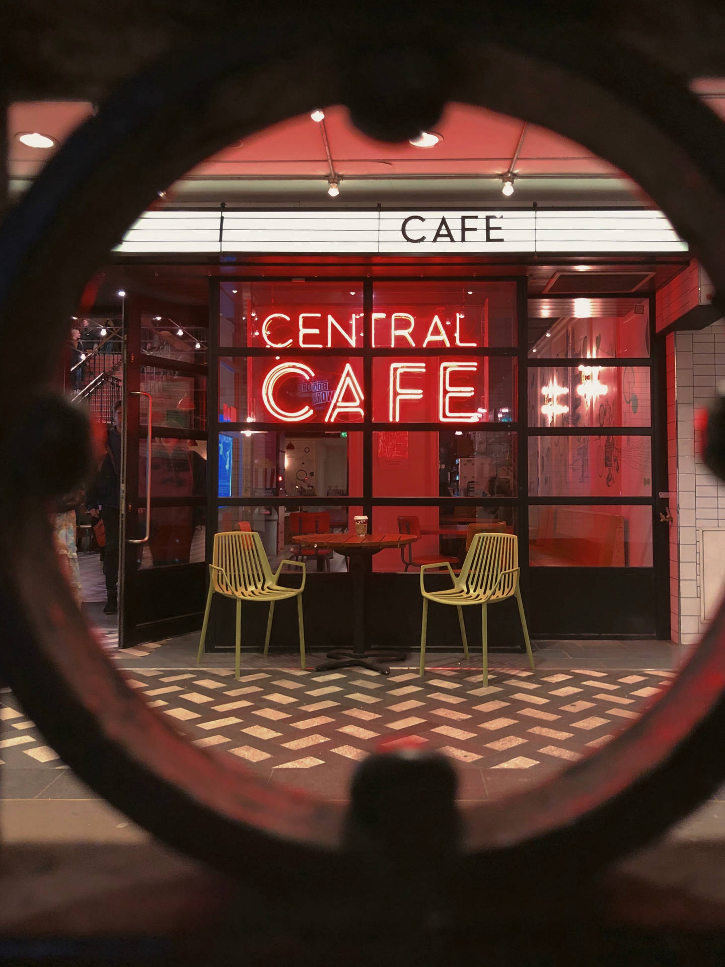 Chill Iphone Cafe With Neon Signage Wallpaper