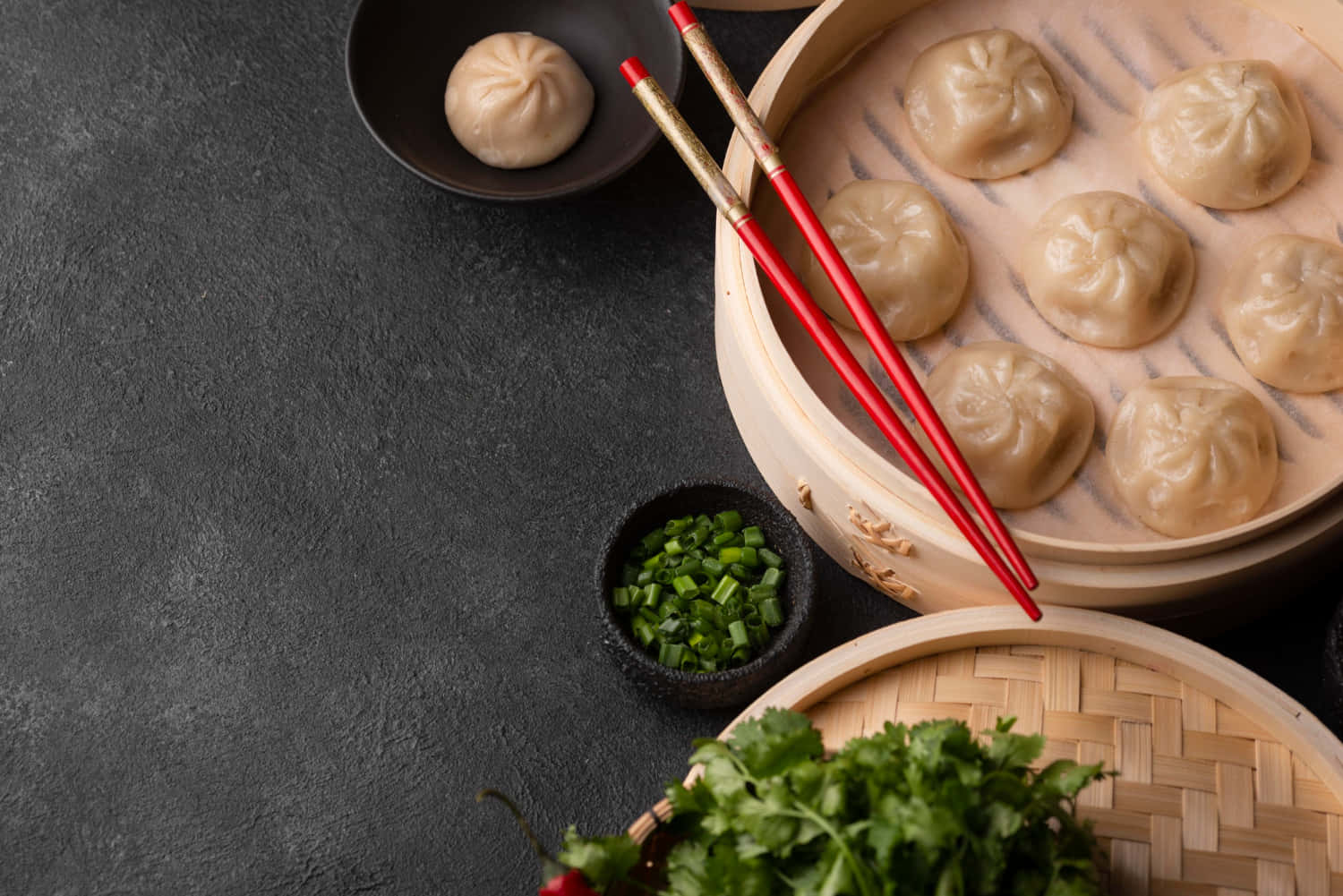 Dumplings, Chopsticks And Vegetables On A Dark Background