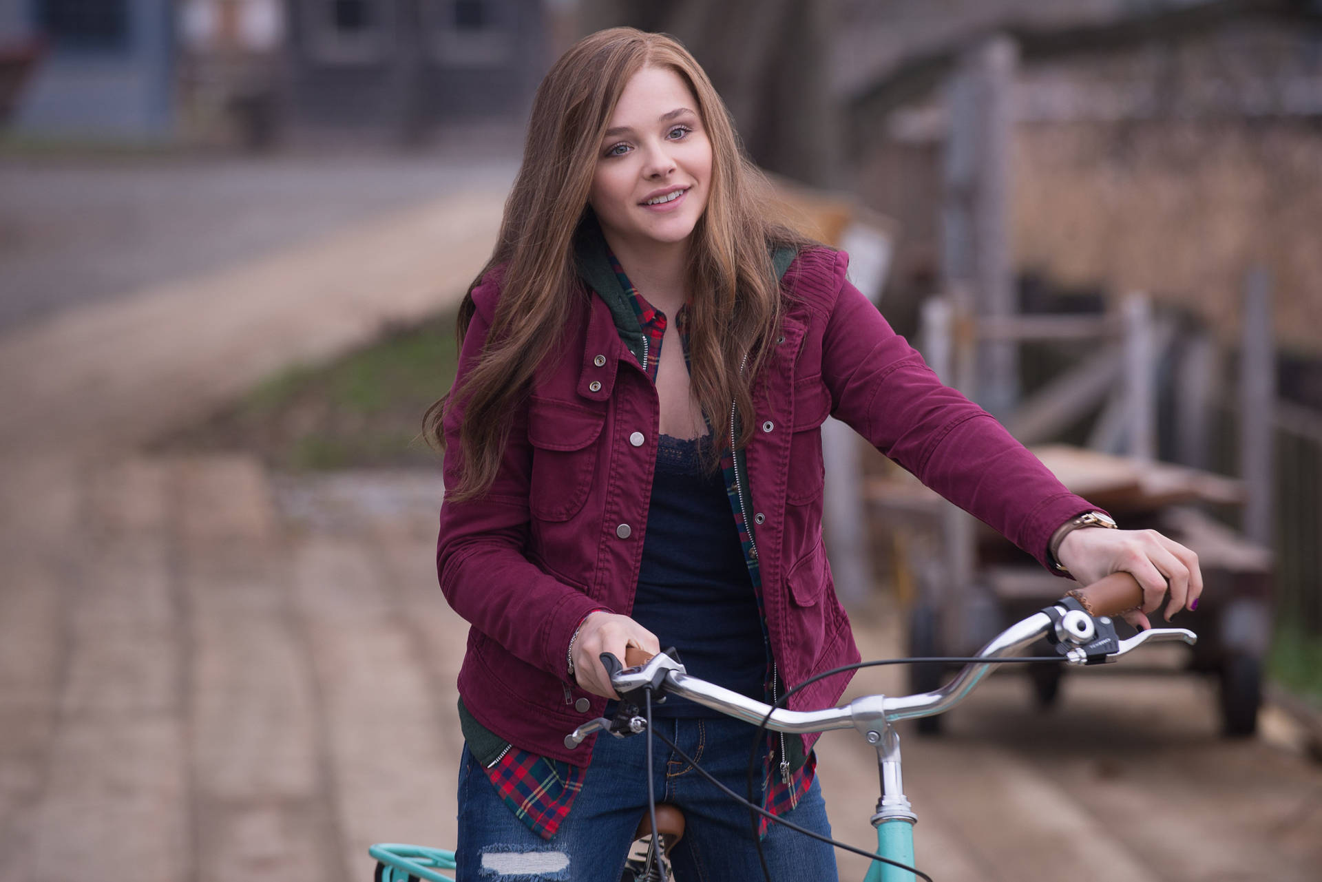 Chloë Grace Moretz Riding A Bike Wallpaper