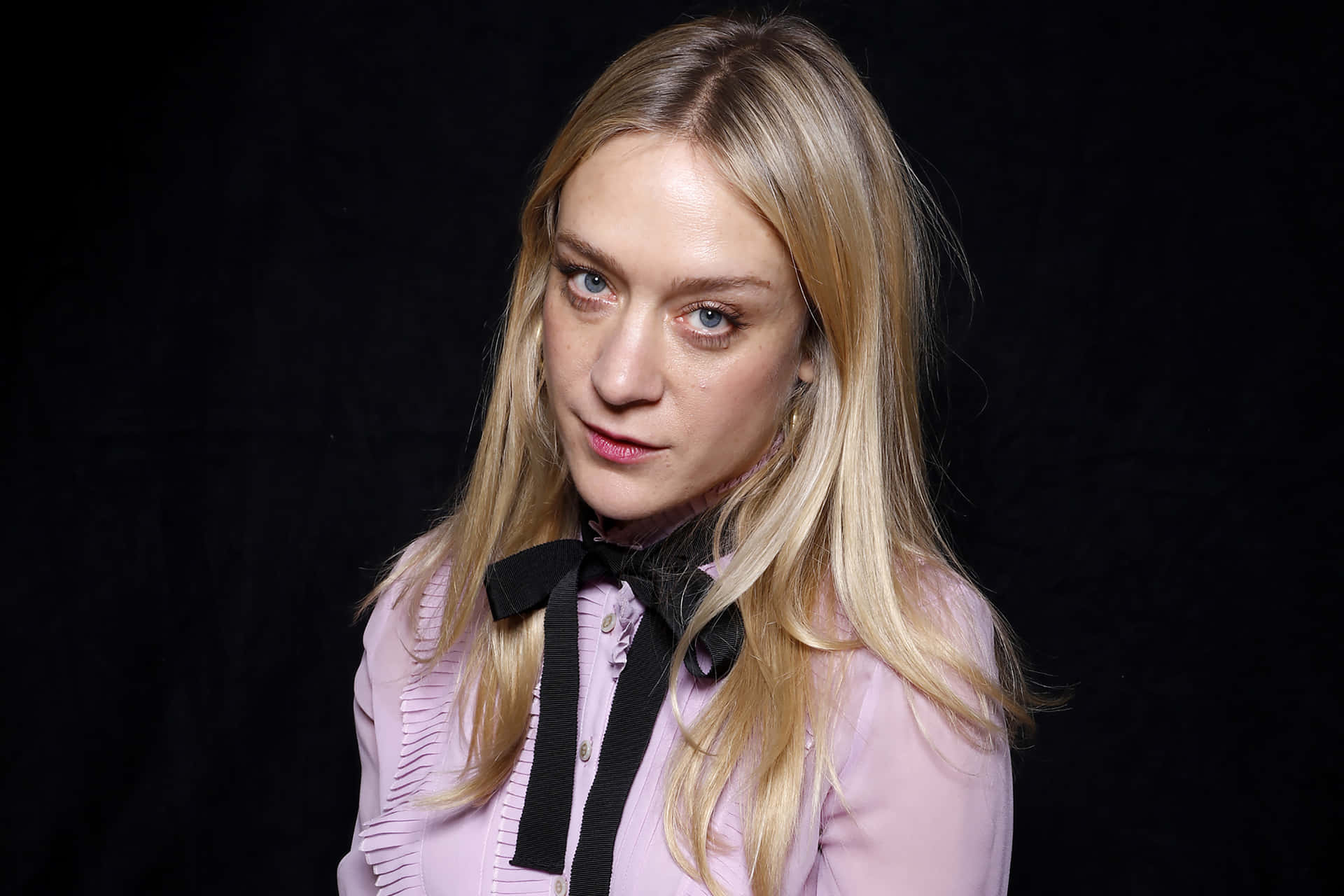 Chloë Sevigny striking a pose outdoors Wallpaper