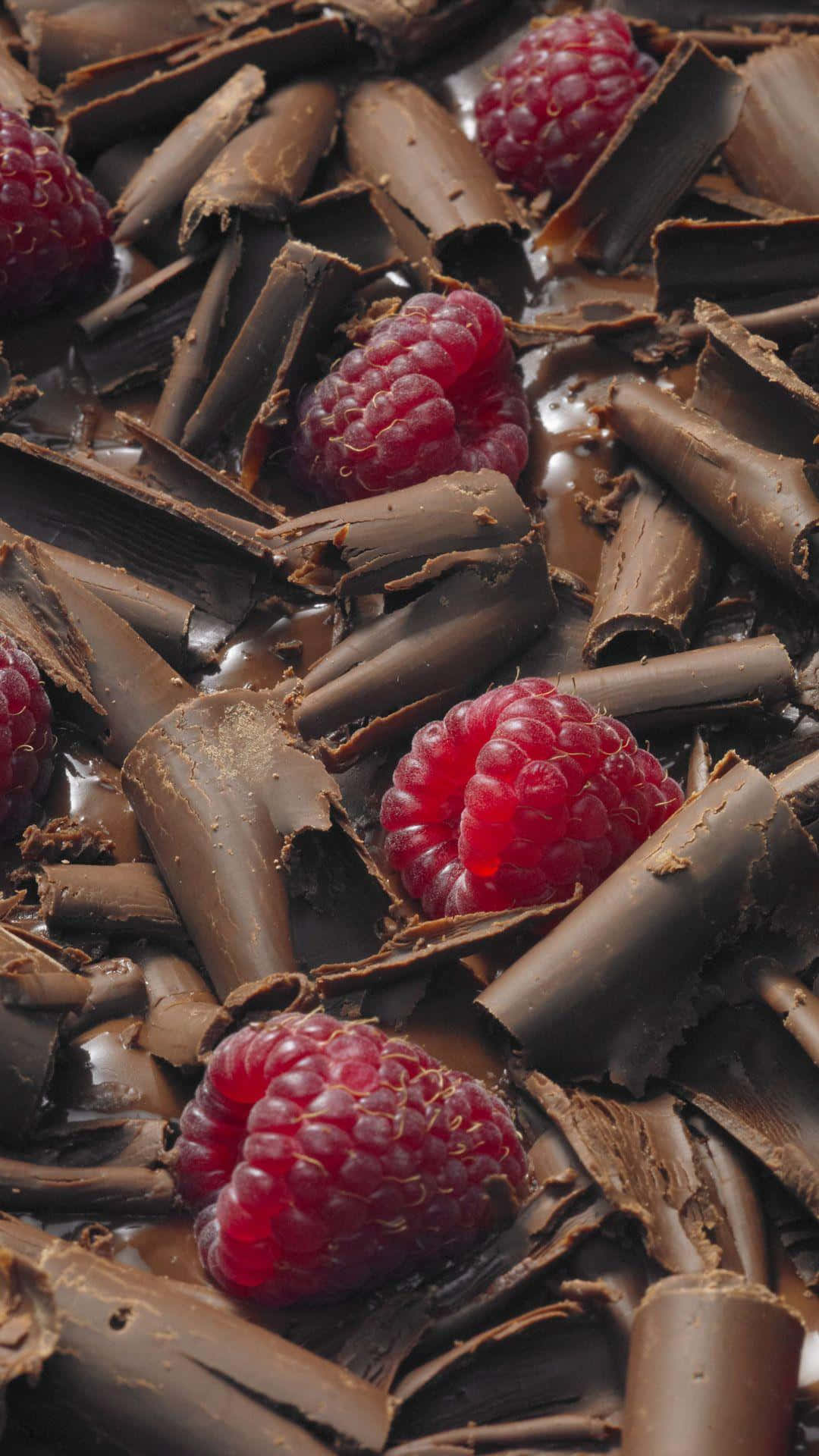 A Plate Of Raspberries And Chocolate