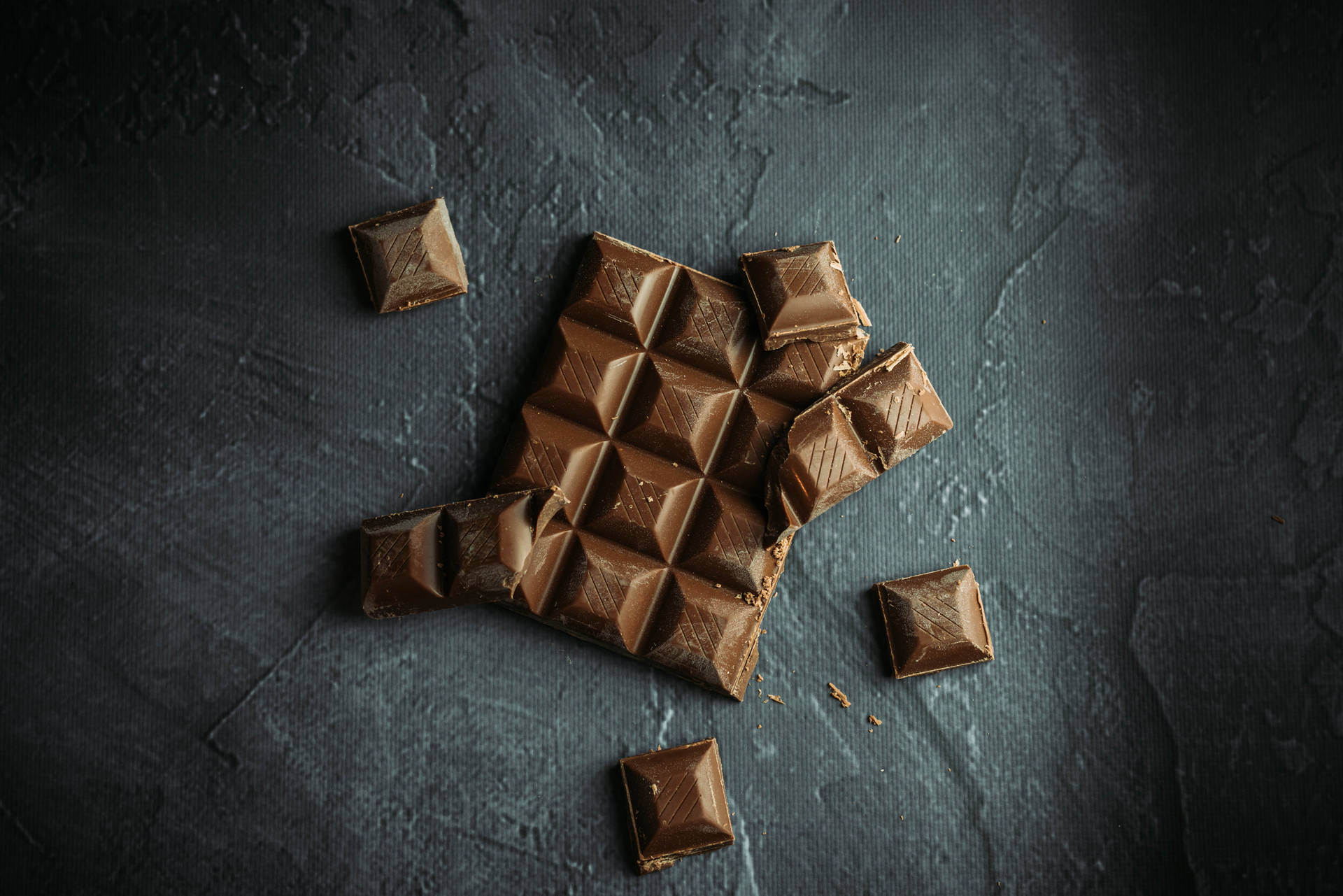 Chocolate Squares On Concrete Wallpaper