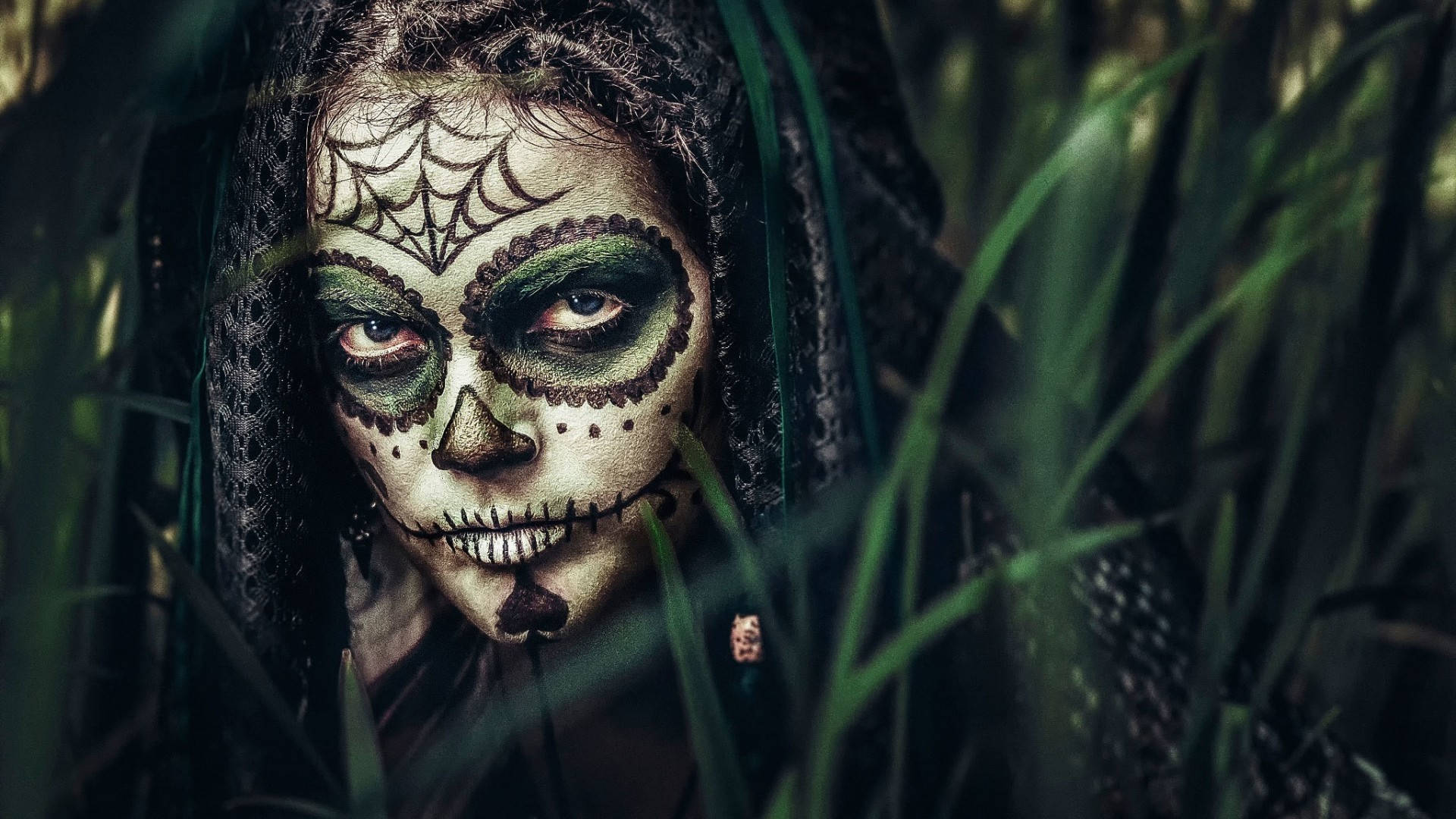 A Woman With Sugar Skull Makeup In Tall Grass Wallpaper