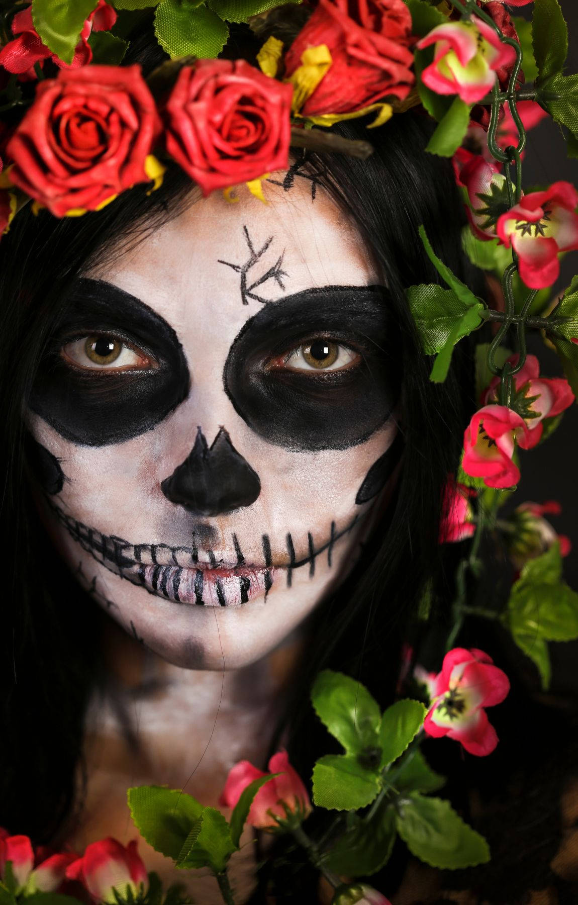 A Woman With A Skull Face And Flowers In Her Hair Wallpaper