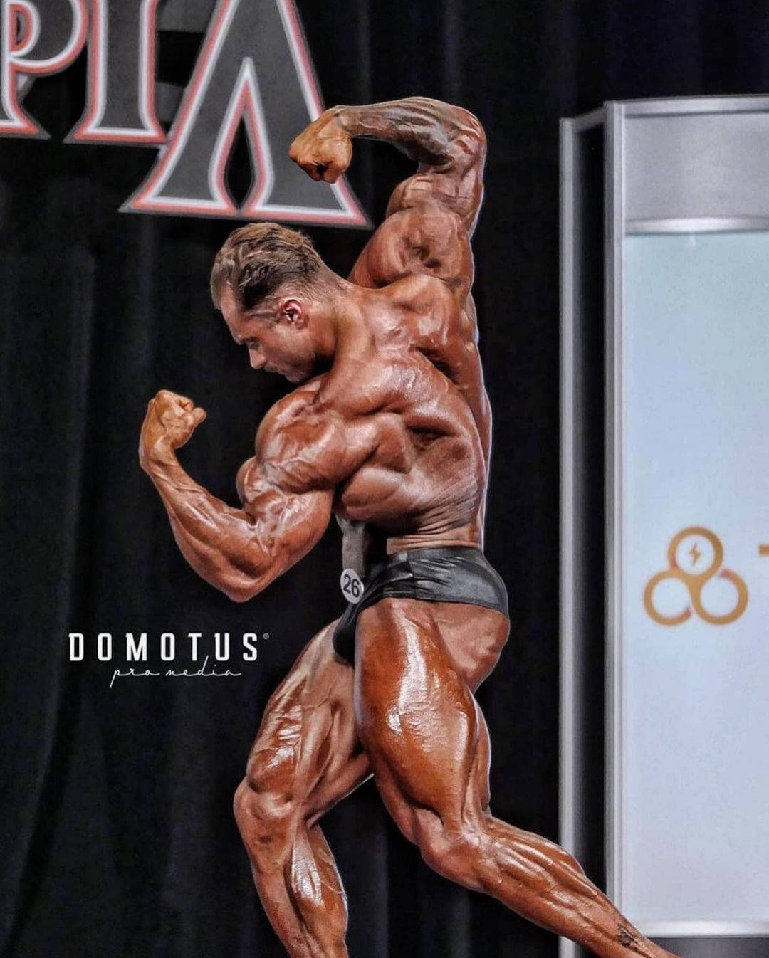 Chris Bumstead At Mr. Olympia Competition Wallpaper