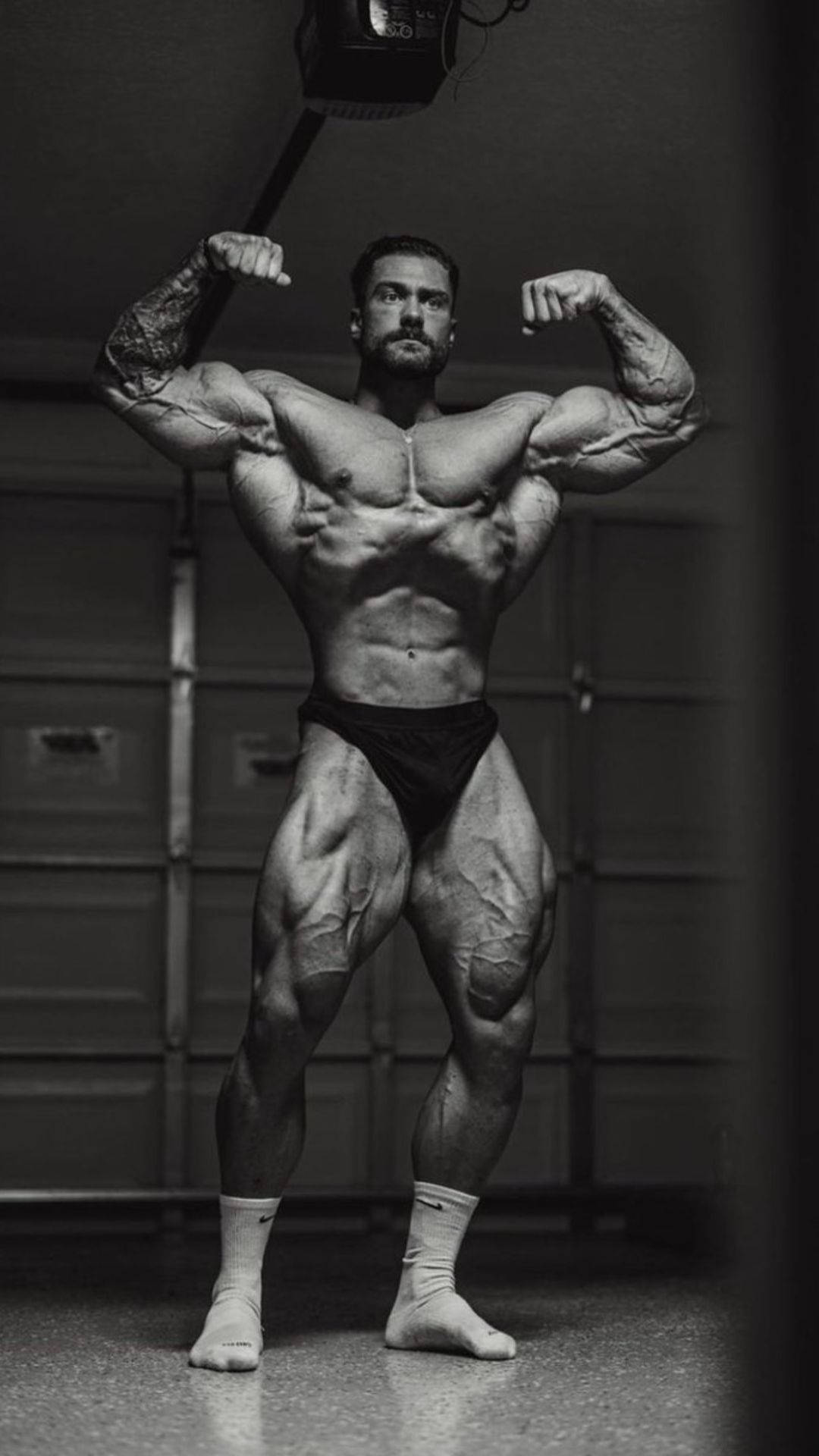 Chris Bumstead Double Front Bicep Pose Wallpaper