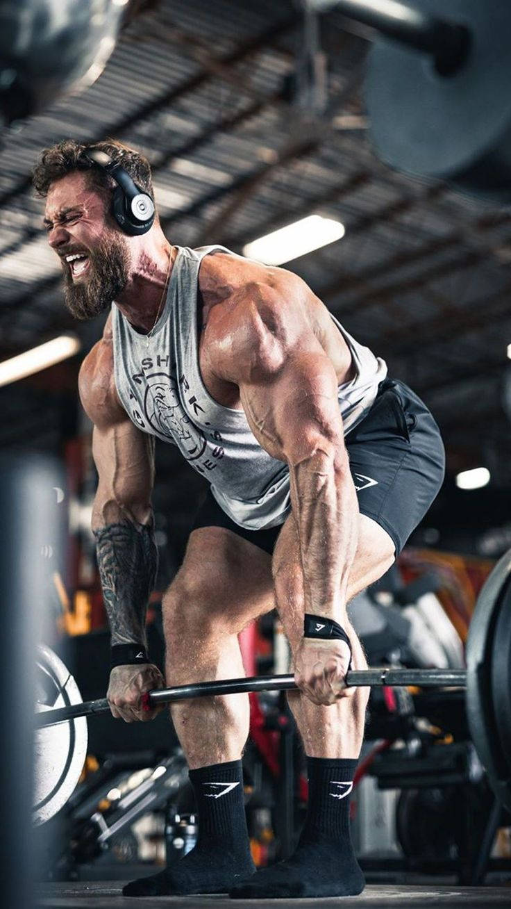 Chris Bumstead Lifting Heavy Weights Wallpaper
