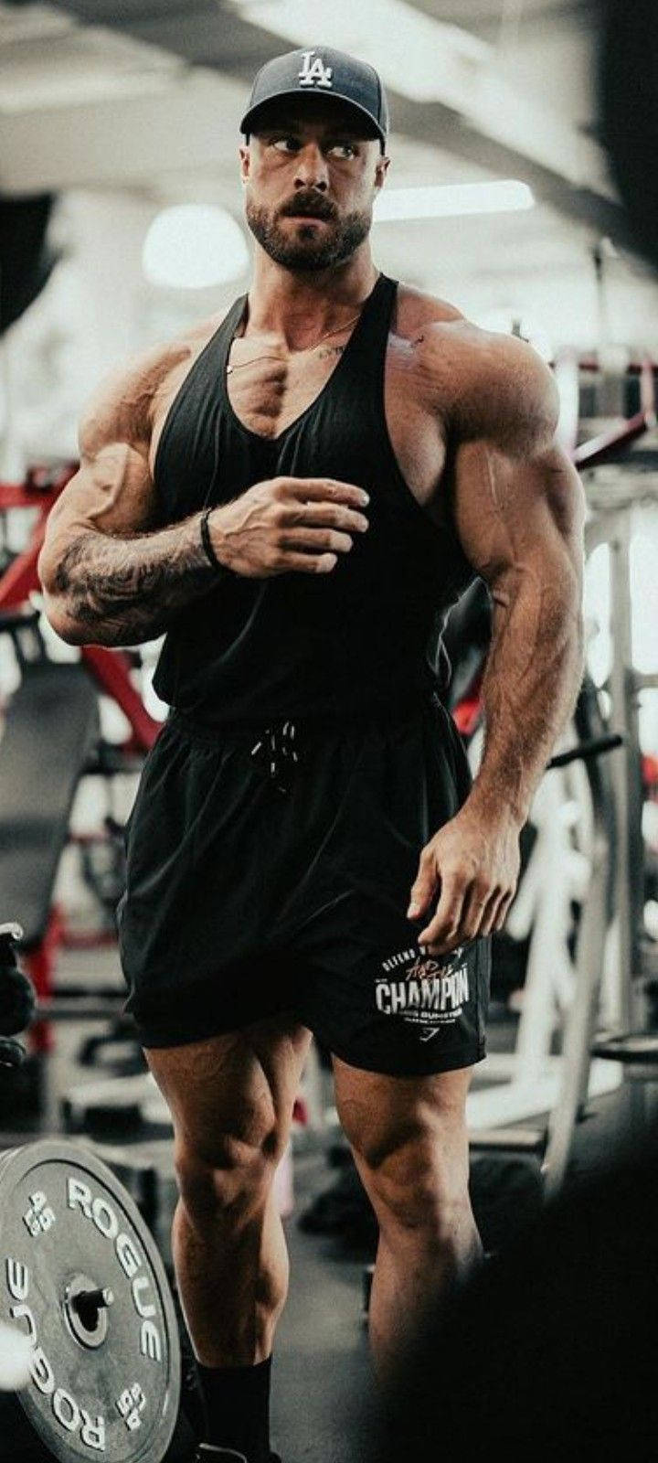 Chris Bumstead Looking At His Side Wallpaper