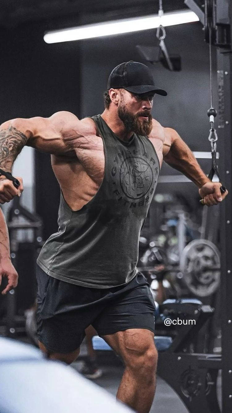 Chris Bumstead Using Cable Gym Equipment Wallpaper