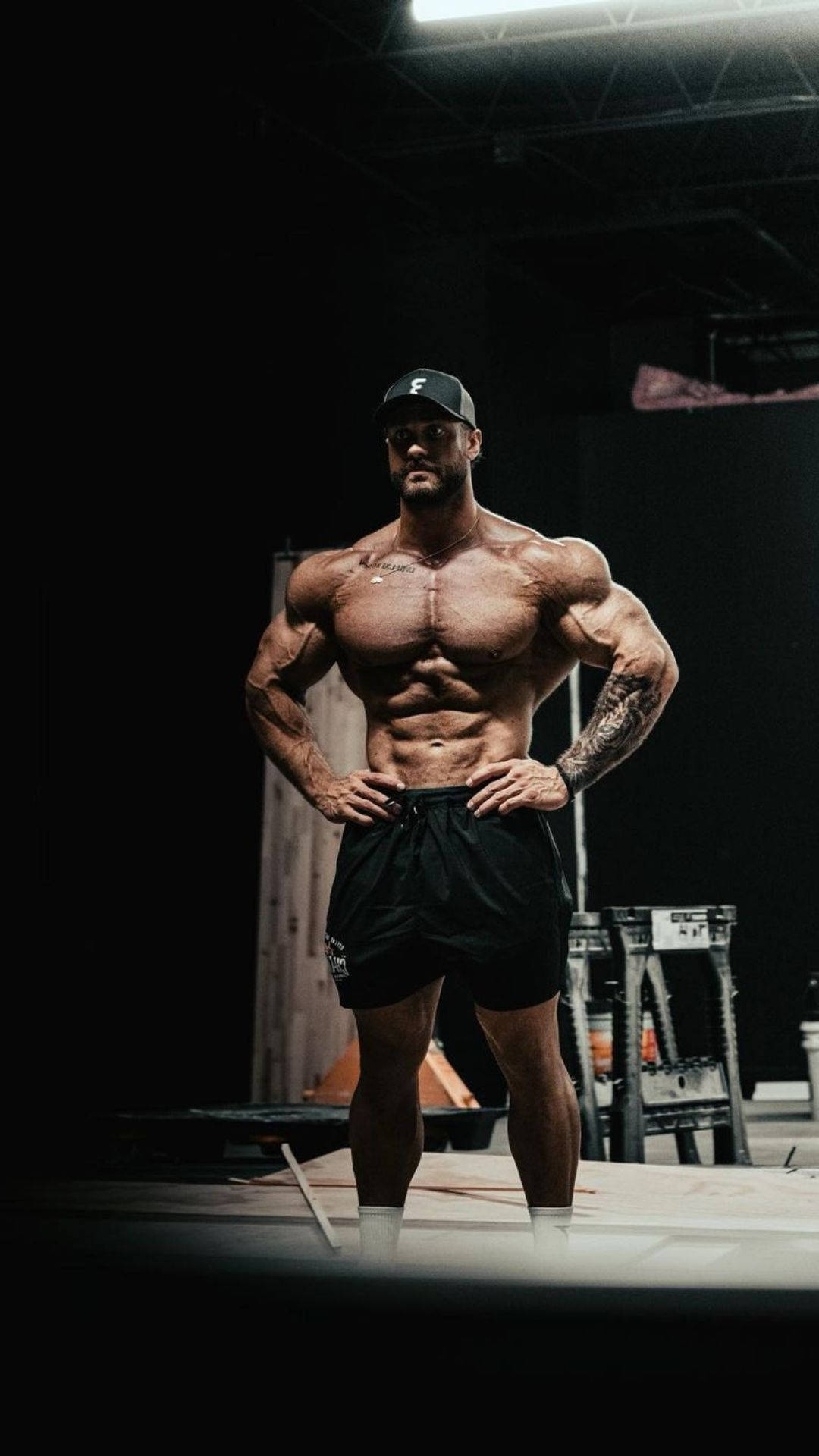 Chris Bumstead With Black Shorts Wallpaper