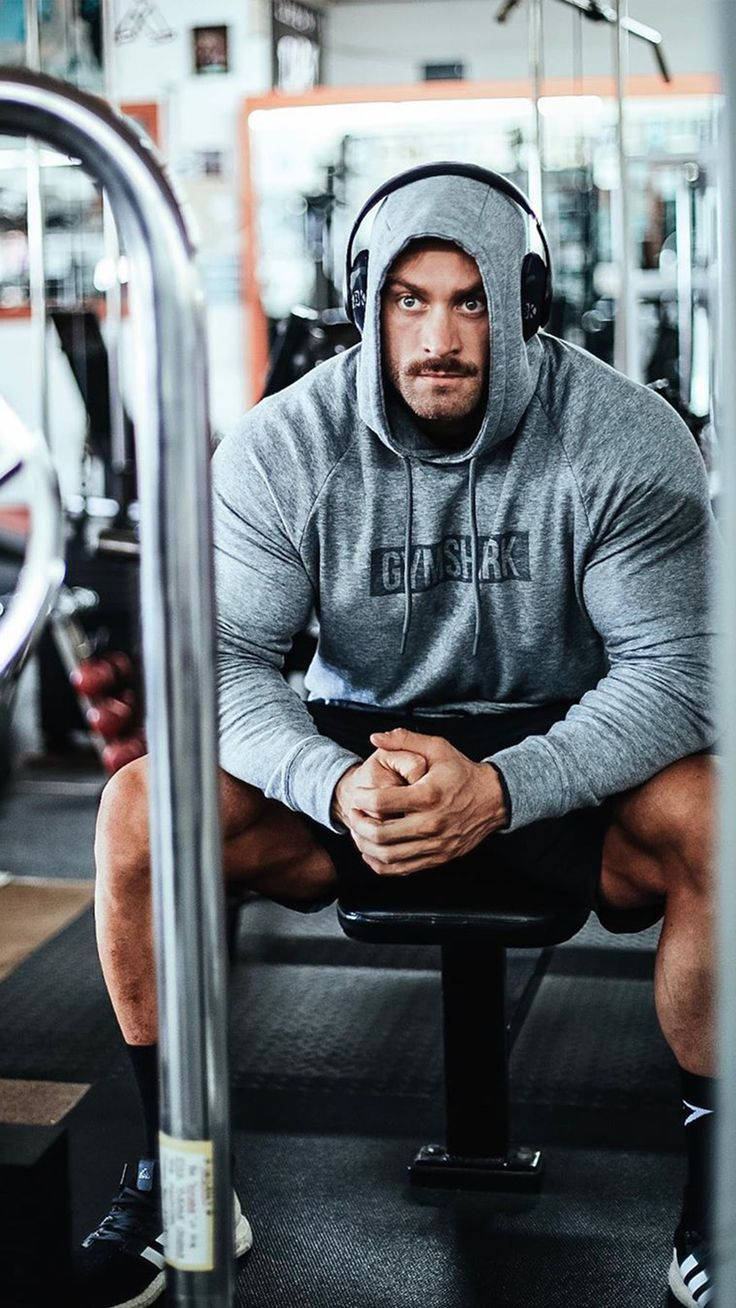 Chris Bumstead With Gray Hoodie Wallpaper