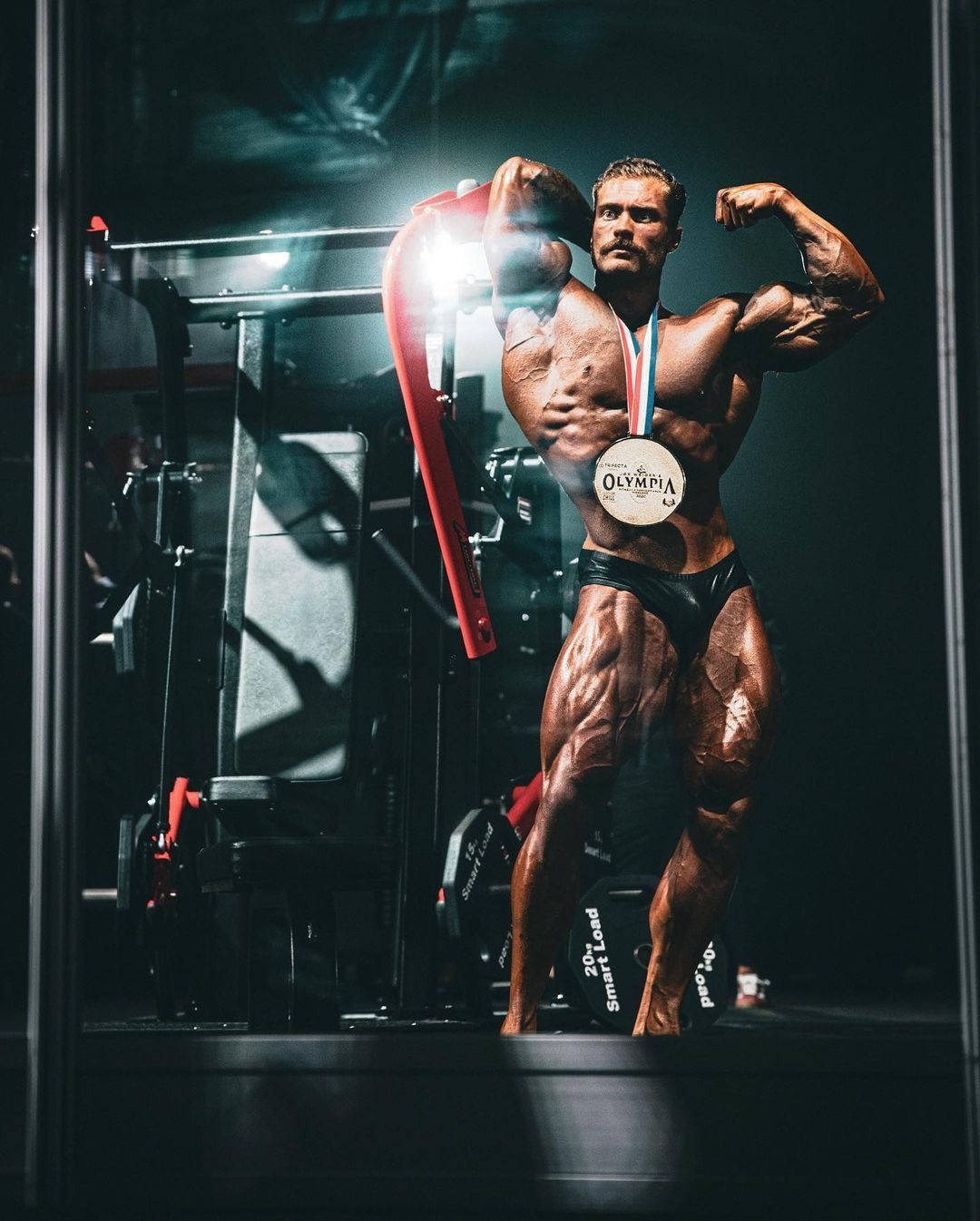 Chris Bumstead With Olympia Medal Wallpaper